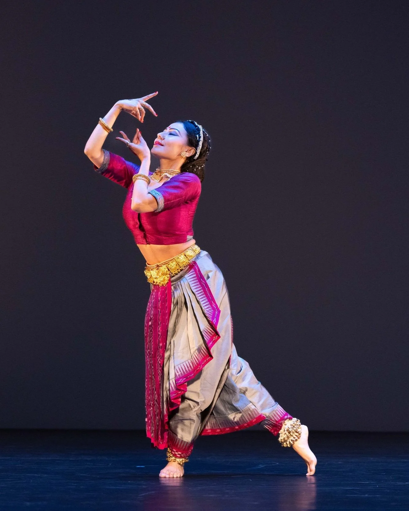 Kaustavi Sarkar on stage in pink costume