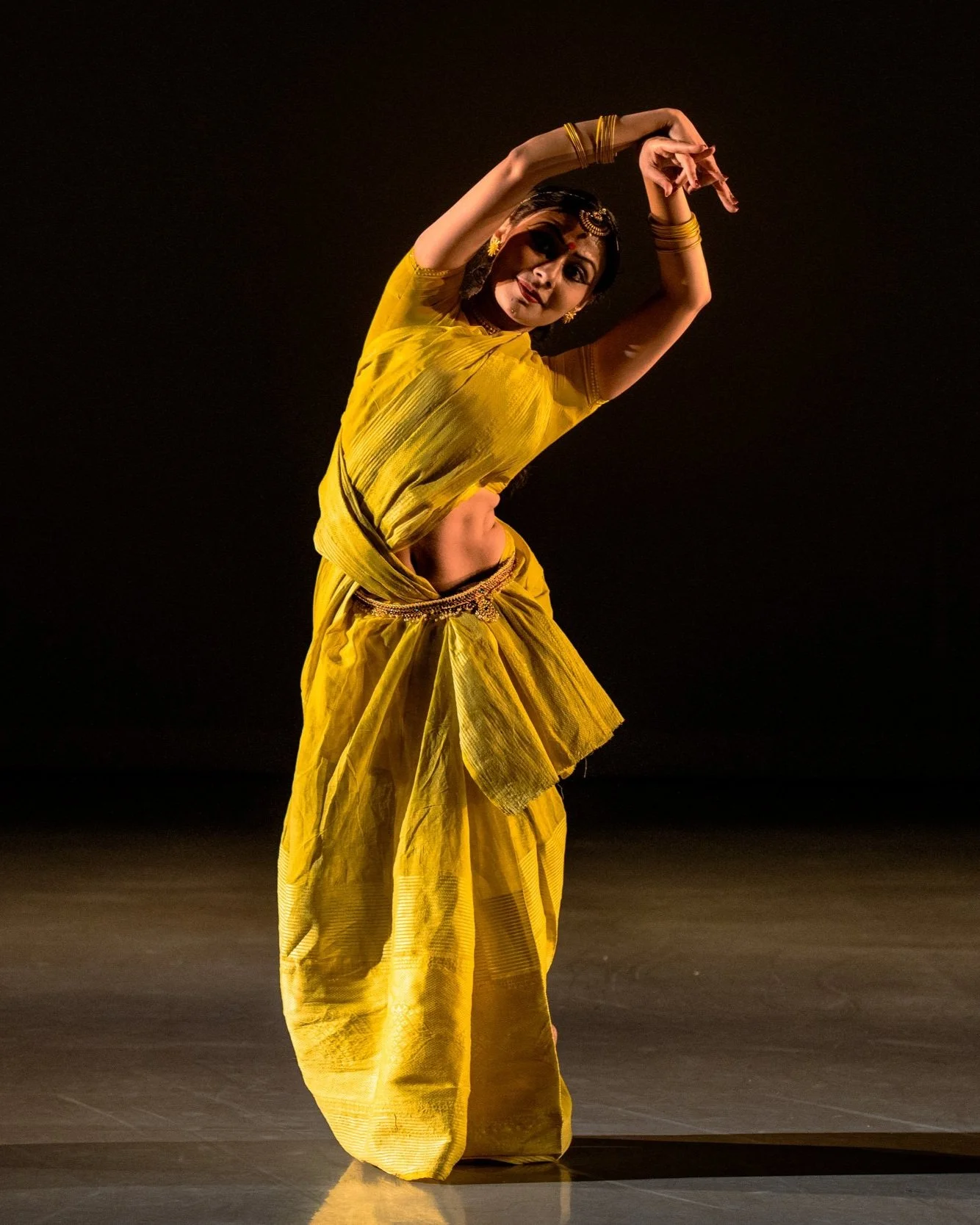 Kaustavi Sarkar on stage in yellow costume