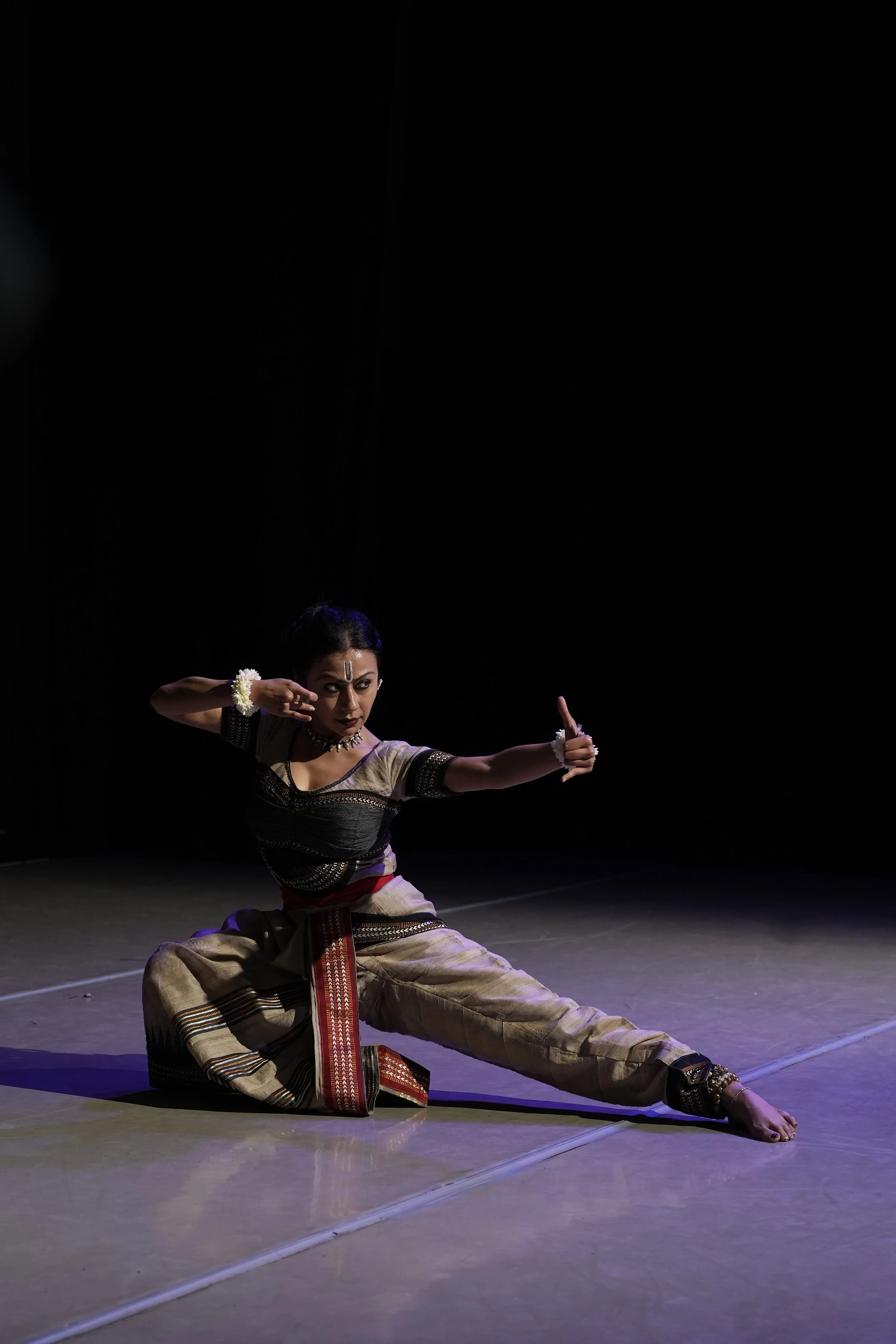 dancer in a lunge on the ground