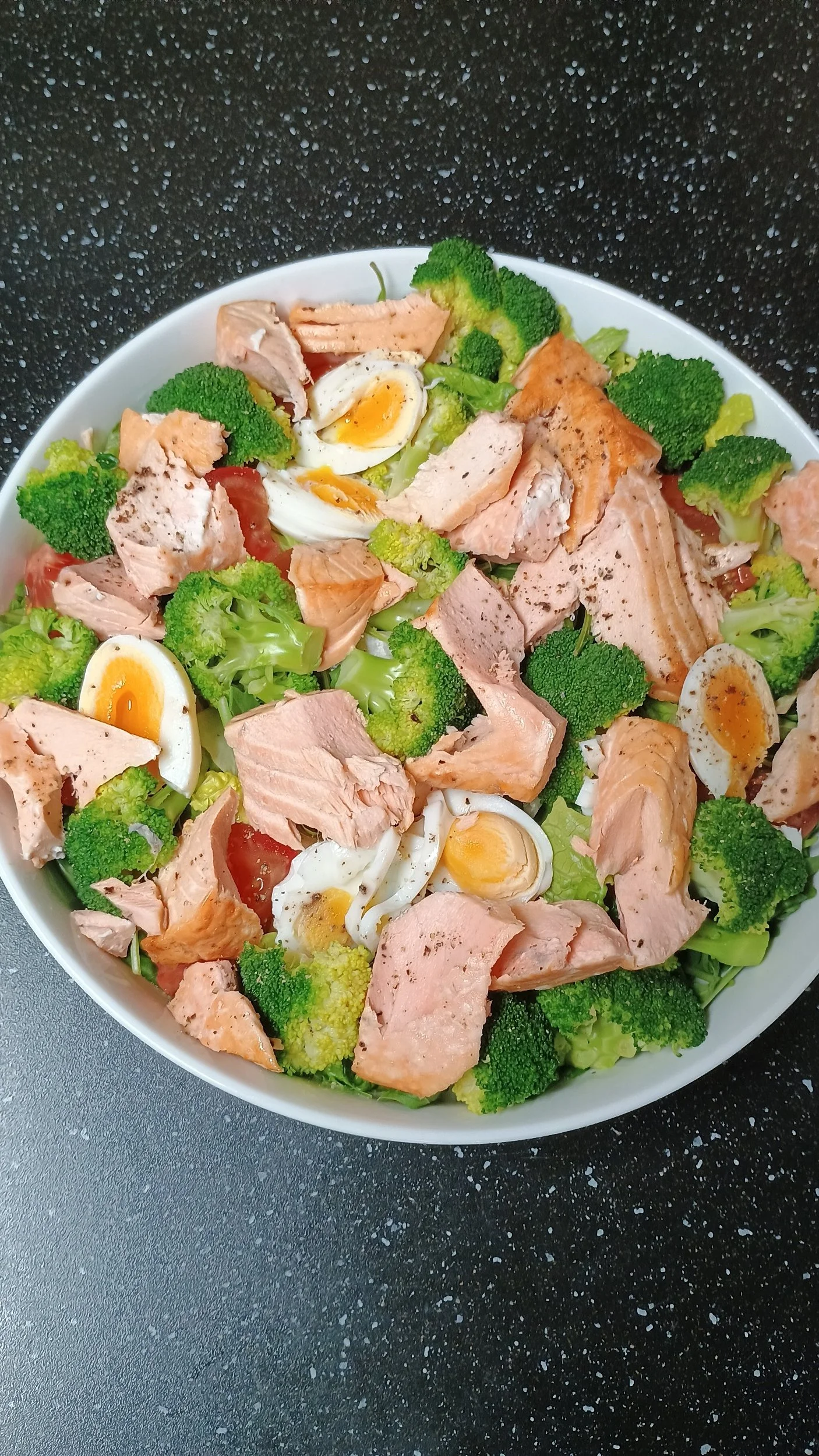 A salmon, broccoli &  boiled eggs, salad