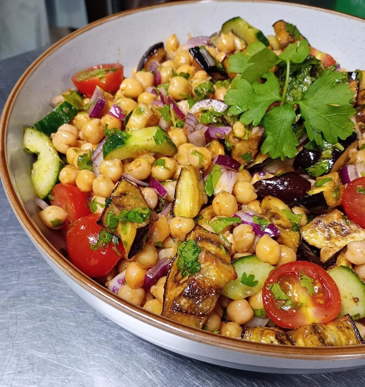 Roasted aubergine and chickpea salad platter served fresh for office catering delivery in London