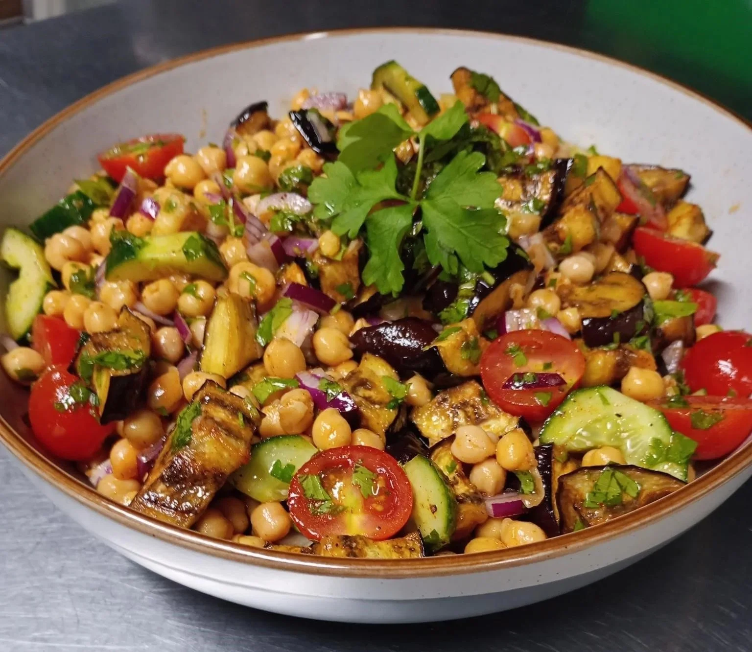 Roasted aubergine and chickpea salad platter served fresh for office catering delivery in London