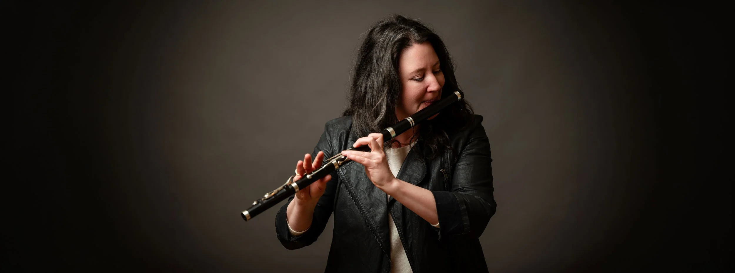 khara wolf holding an irish flute