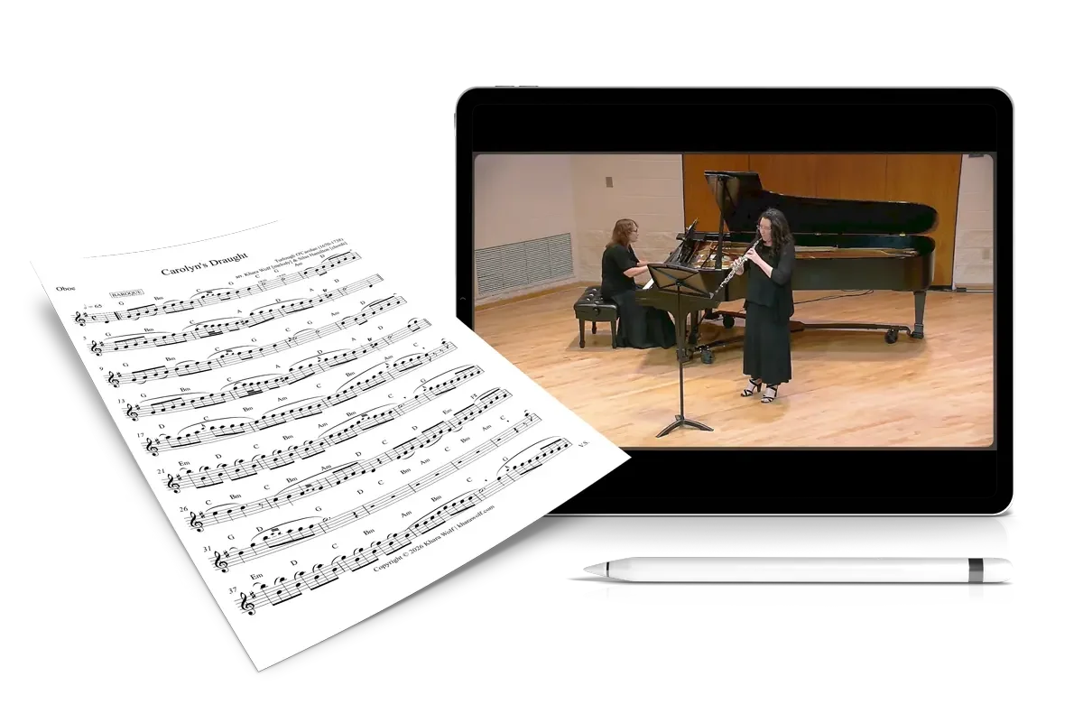 sheet music next to an ipad with a video on it