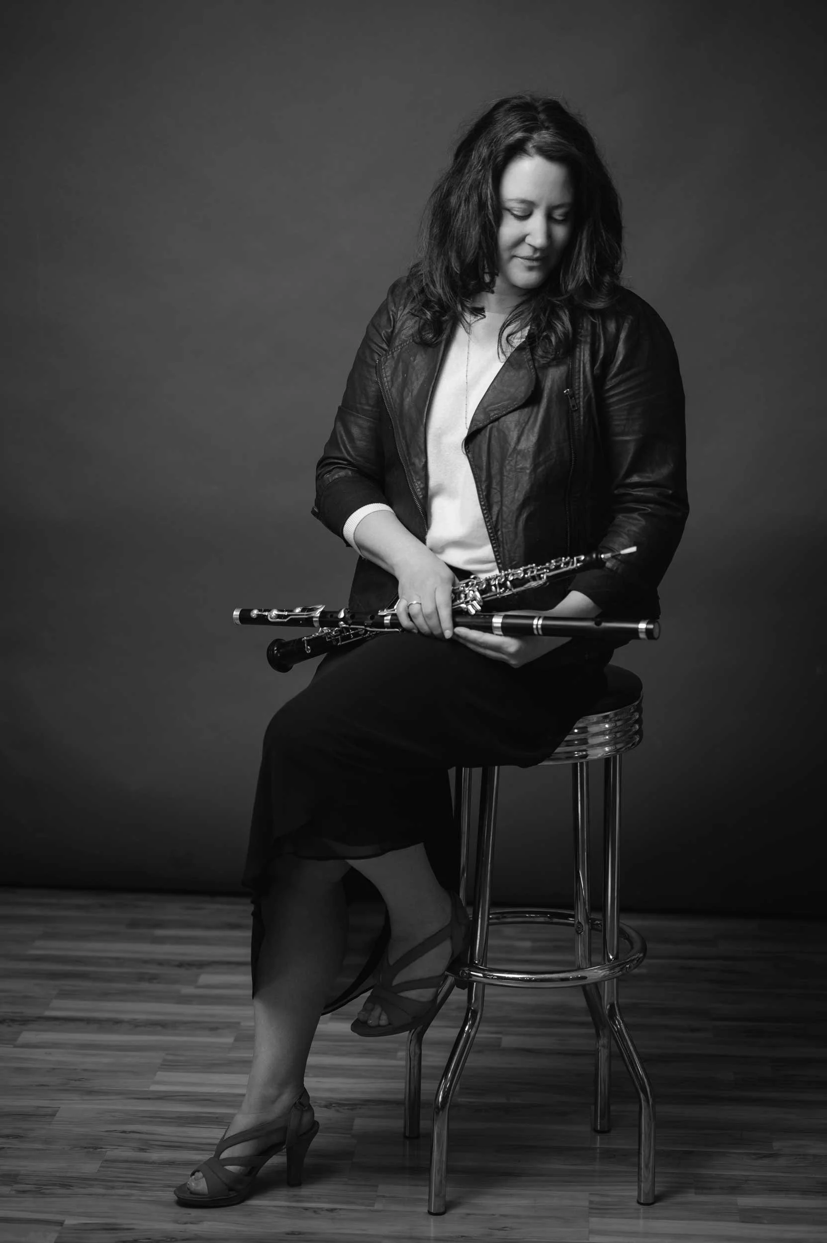 khara wolf looking down at an oboe and trad flute