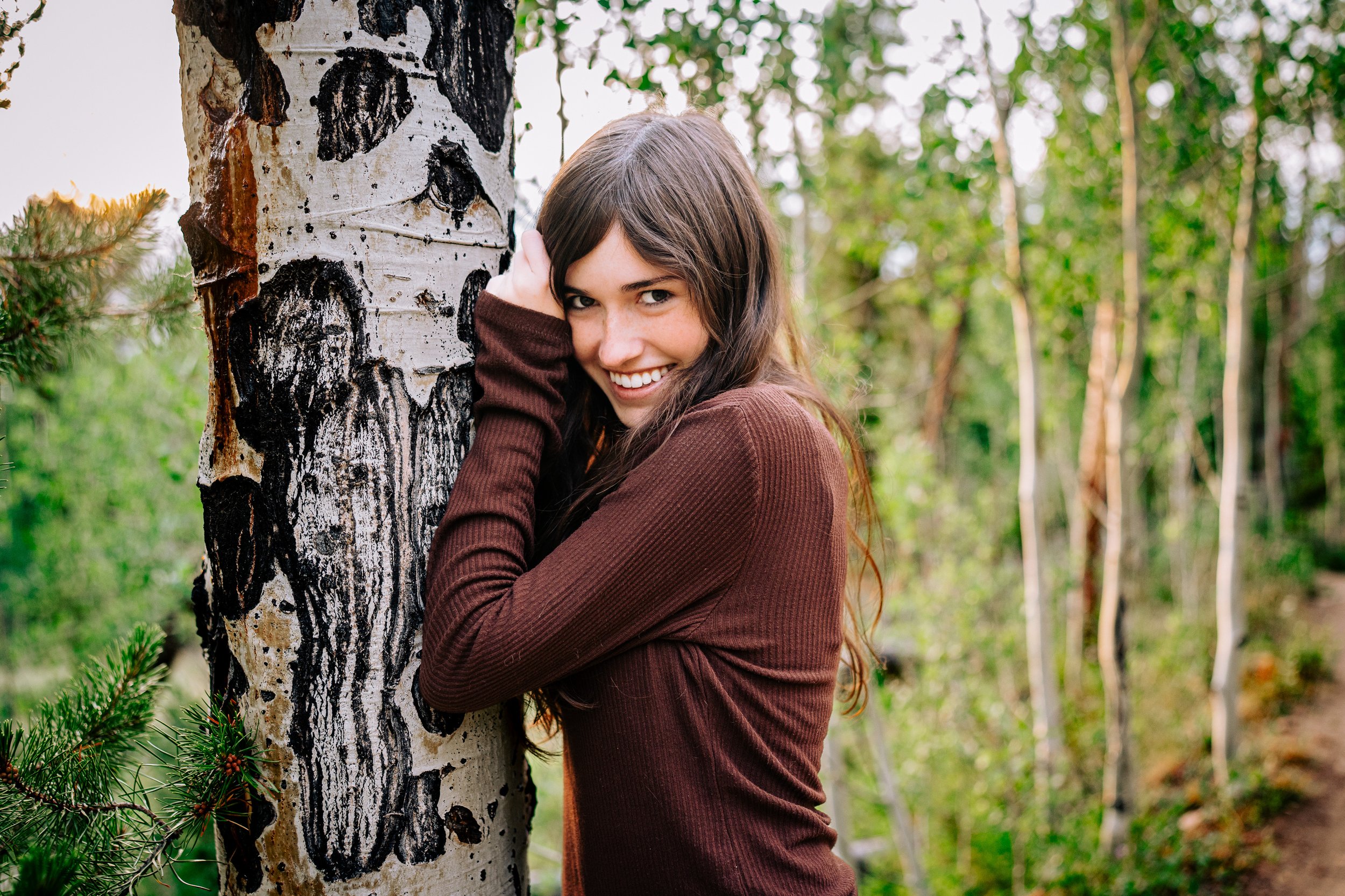 High school senior portrait session in golden light in Boulder, Colorado.