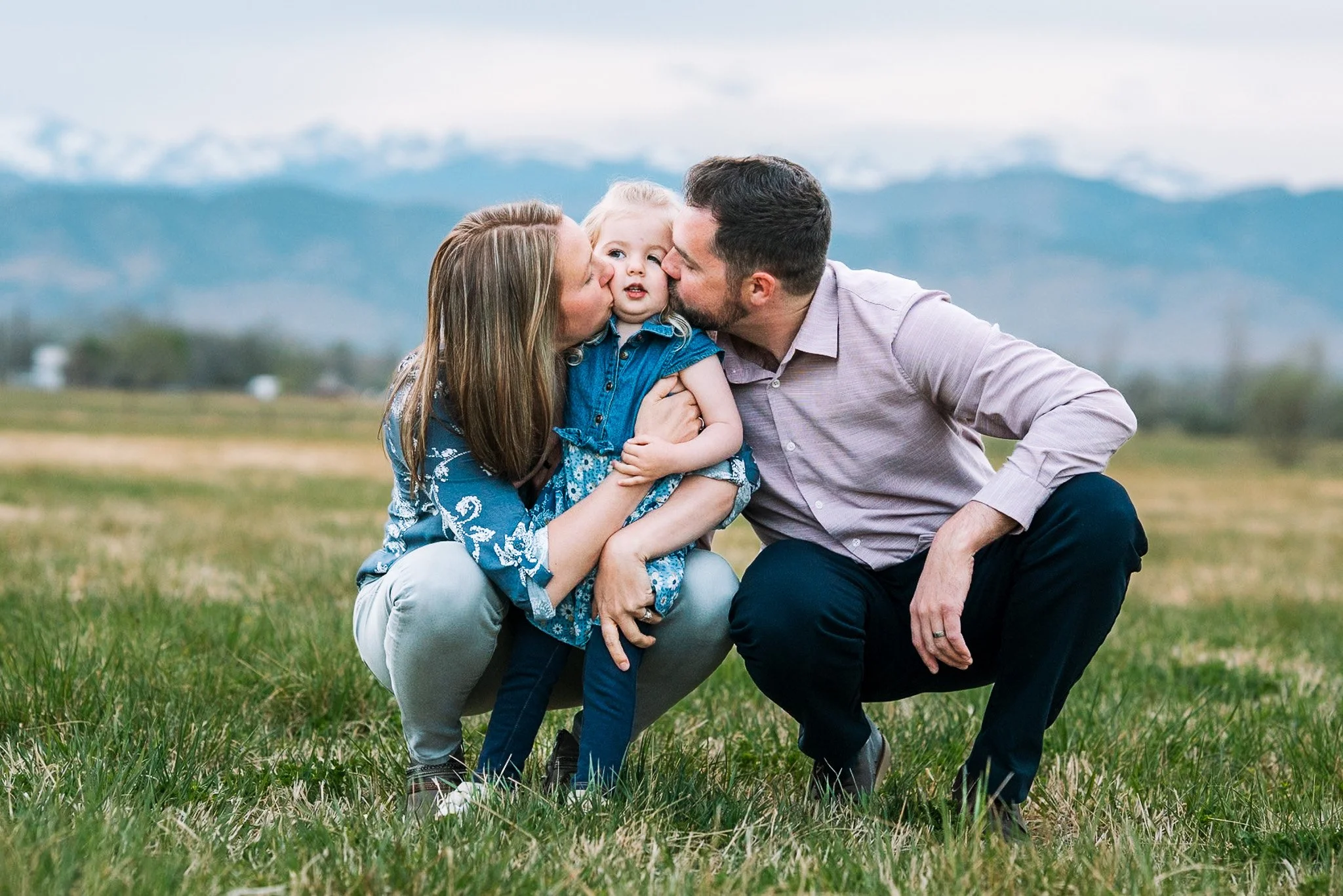 Boulder family photos in a meadow with mountains