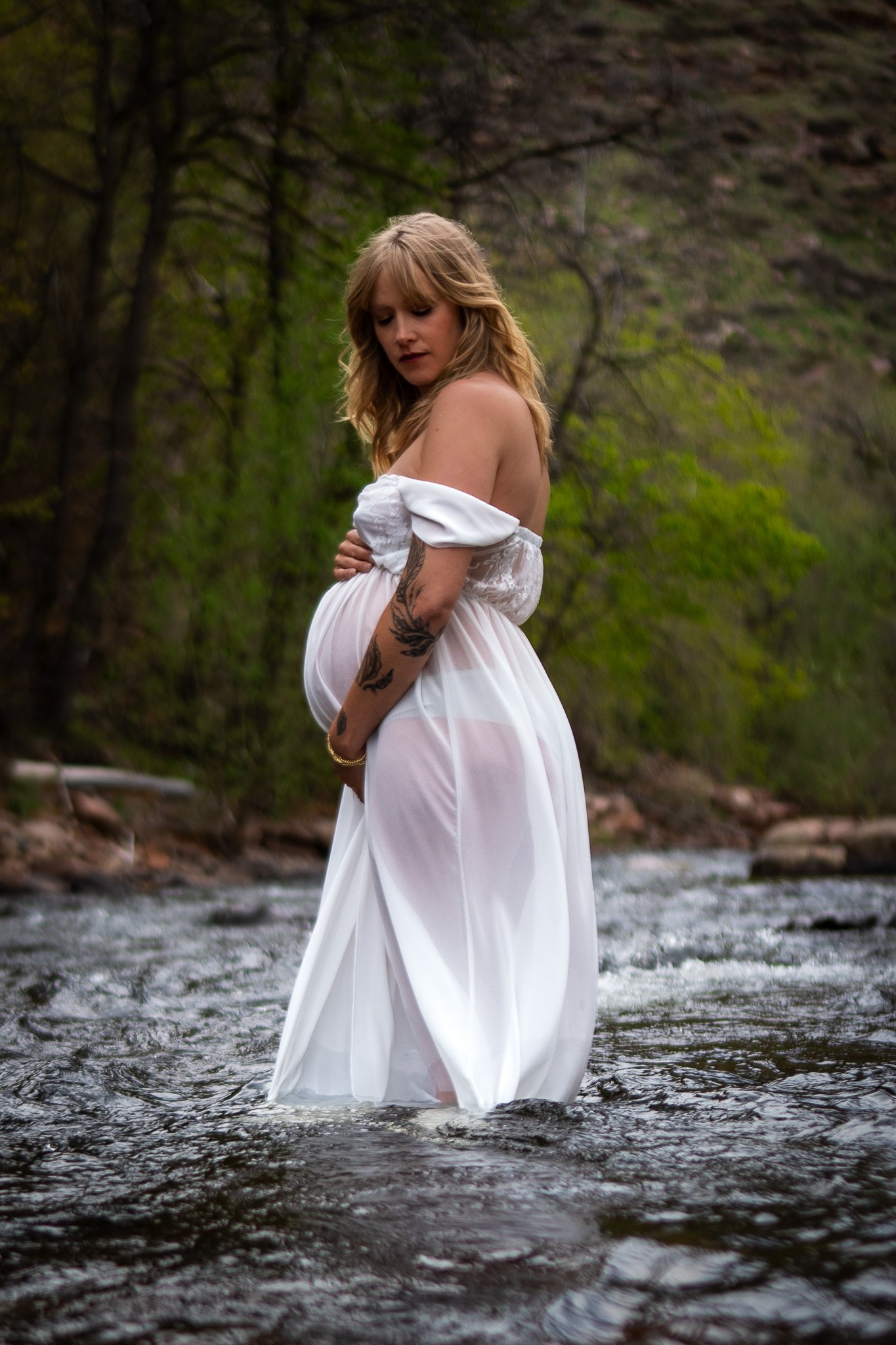 Maternity photo session with a flowy white dress