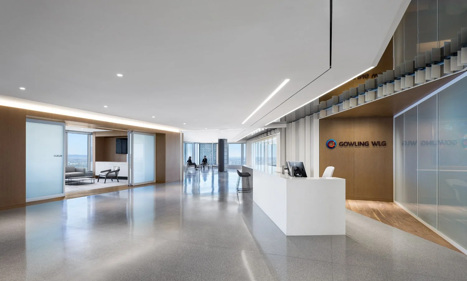 Modern corporate office lobby with reception desk, seating area, and large windows with city view, featuring wood and glass accents.