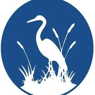 image of white crane and plants against a blue background