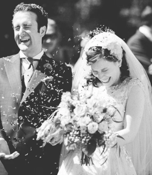 Bride wearing a bespoke bridal hat with elegant handcrafted detailing