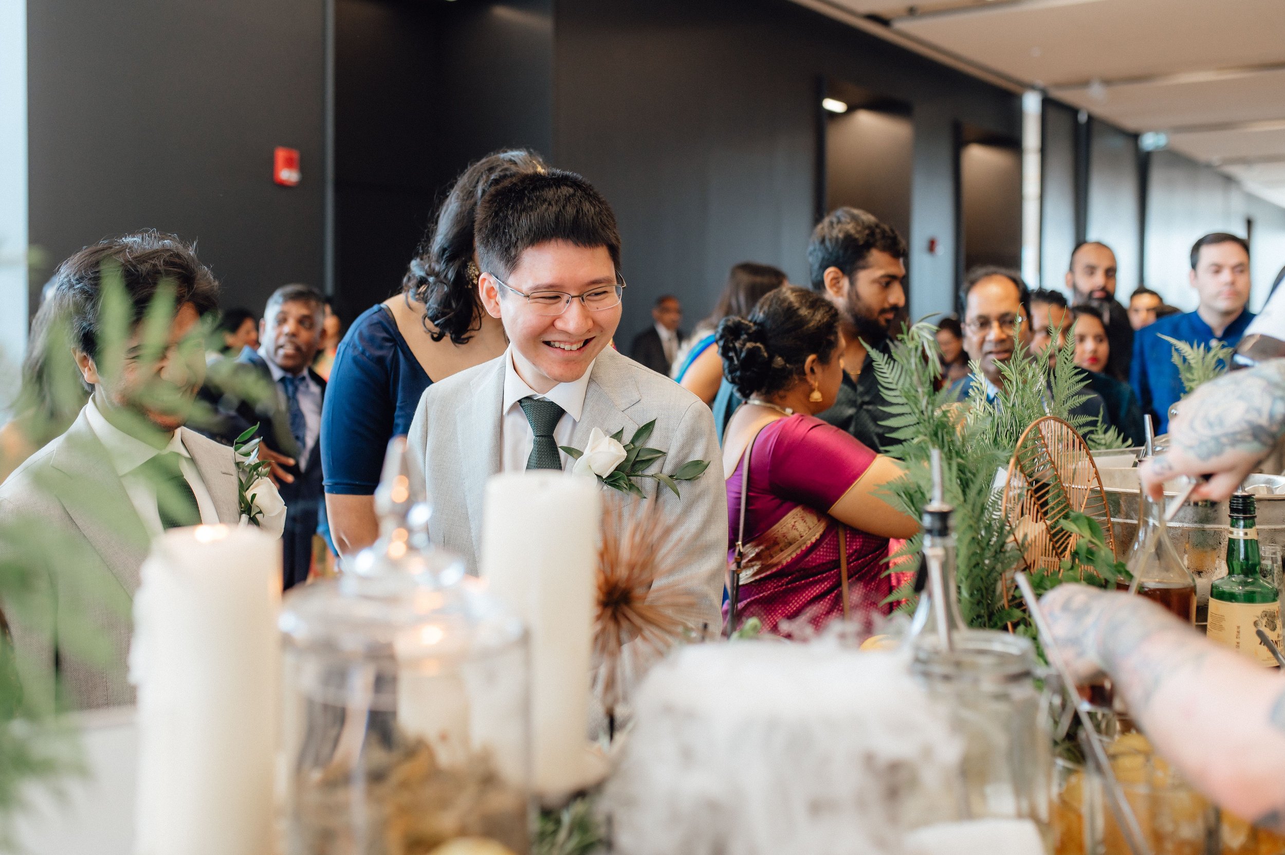Guests enjoying refreshments during a multifaith multicultural wedding at the Globe and Mail Centre in Toronto.