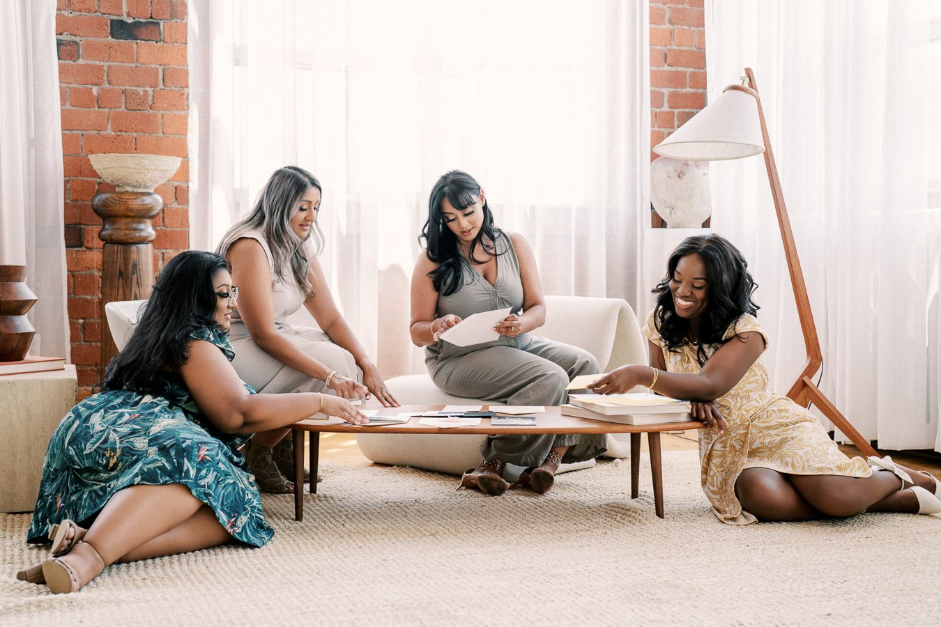 Wedding planner reviewing a luxury wedding timeline with a couple during the planning process.
