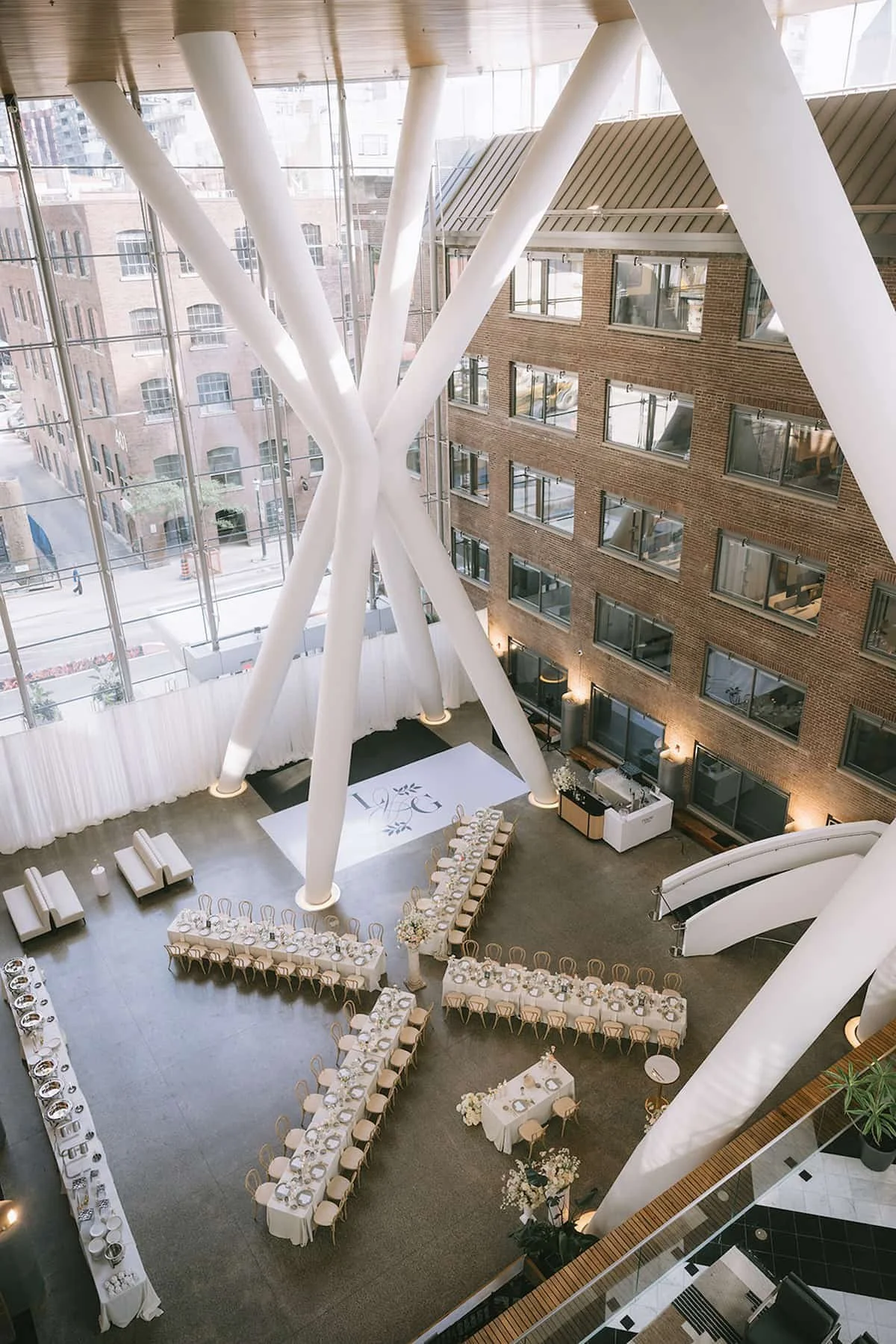 Reception layout at Ricarda's Toronto showing long banquet tables, guest flow and modern wedding design.