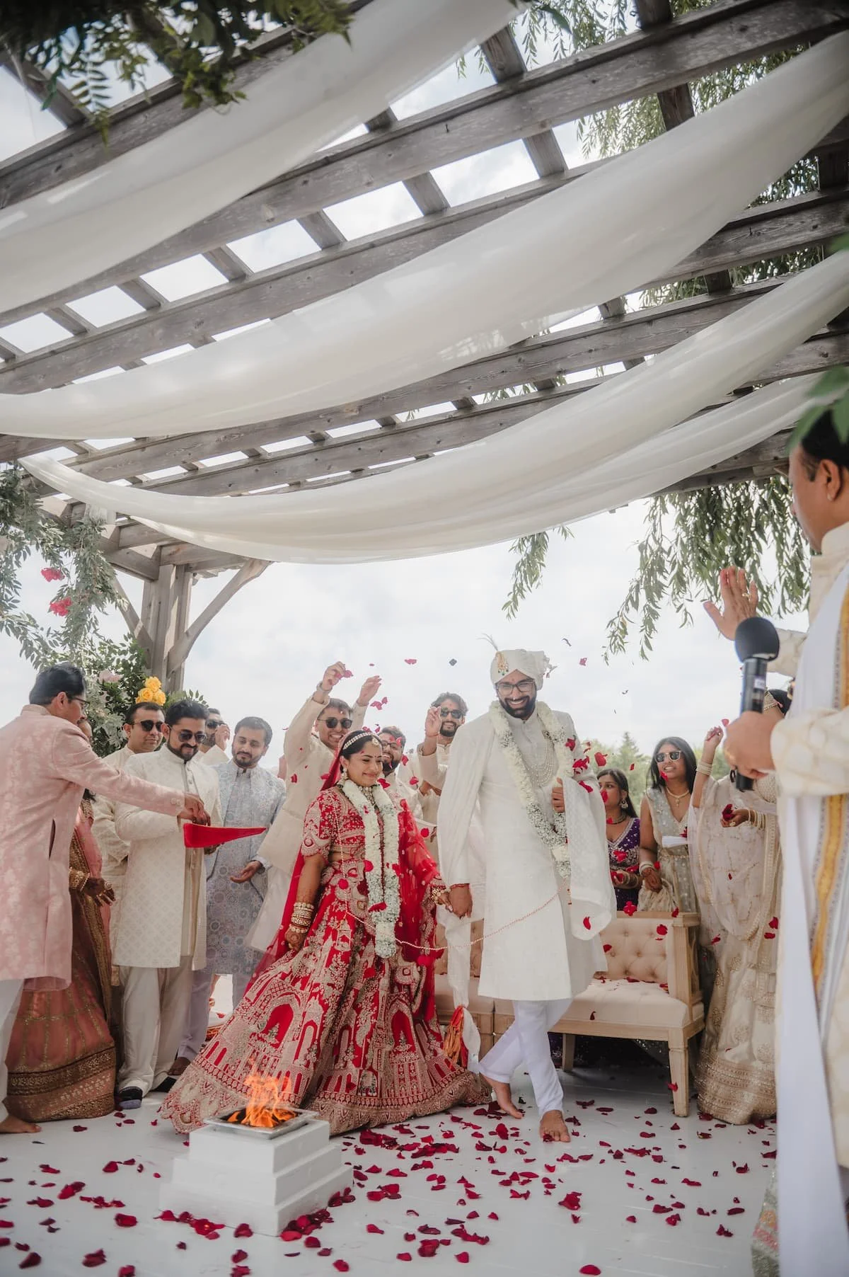 Bride and groom walking around the sacred fire during their Hindu wedding ceremony at Arlington Estate.