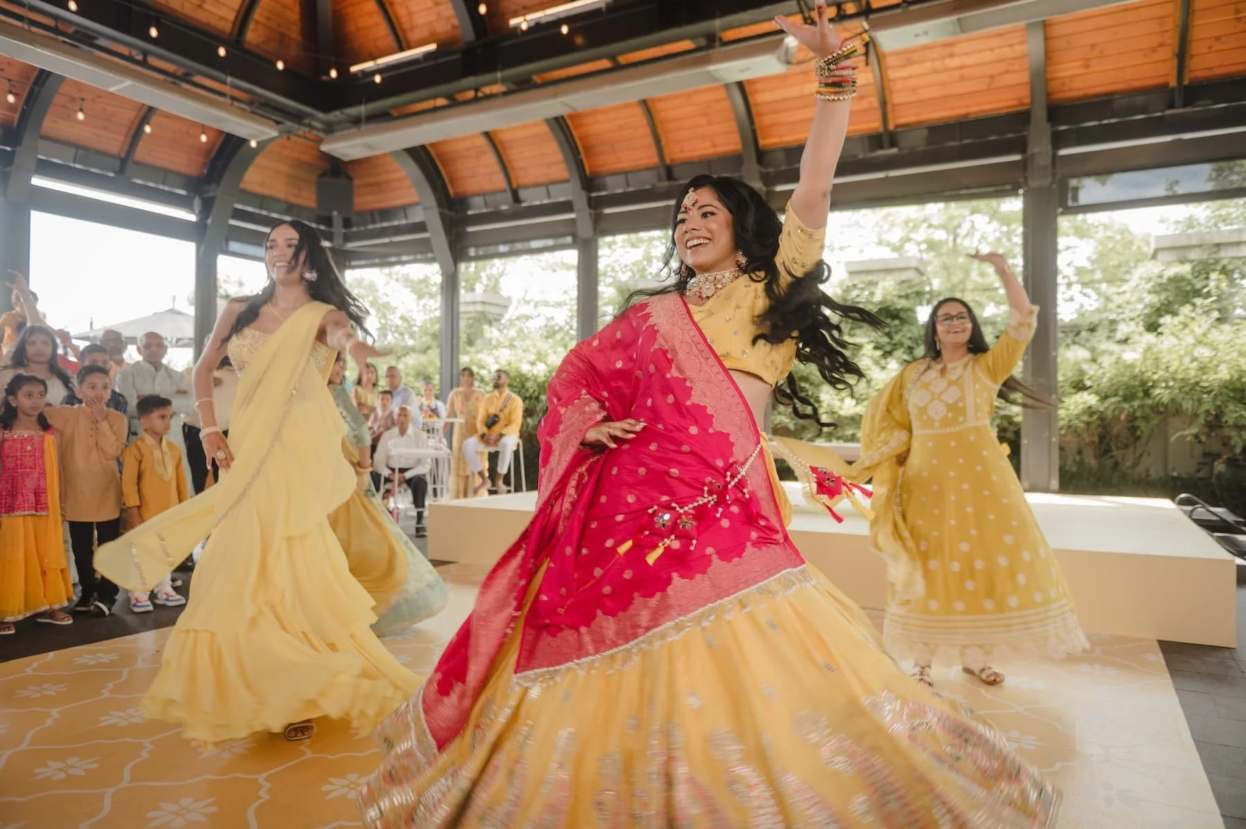 Bride Ashika dancing during her Haldi celebration at Arlington Estate in Vaughan before her South Asian wedding to Sagar.