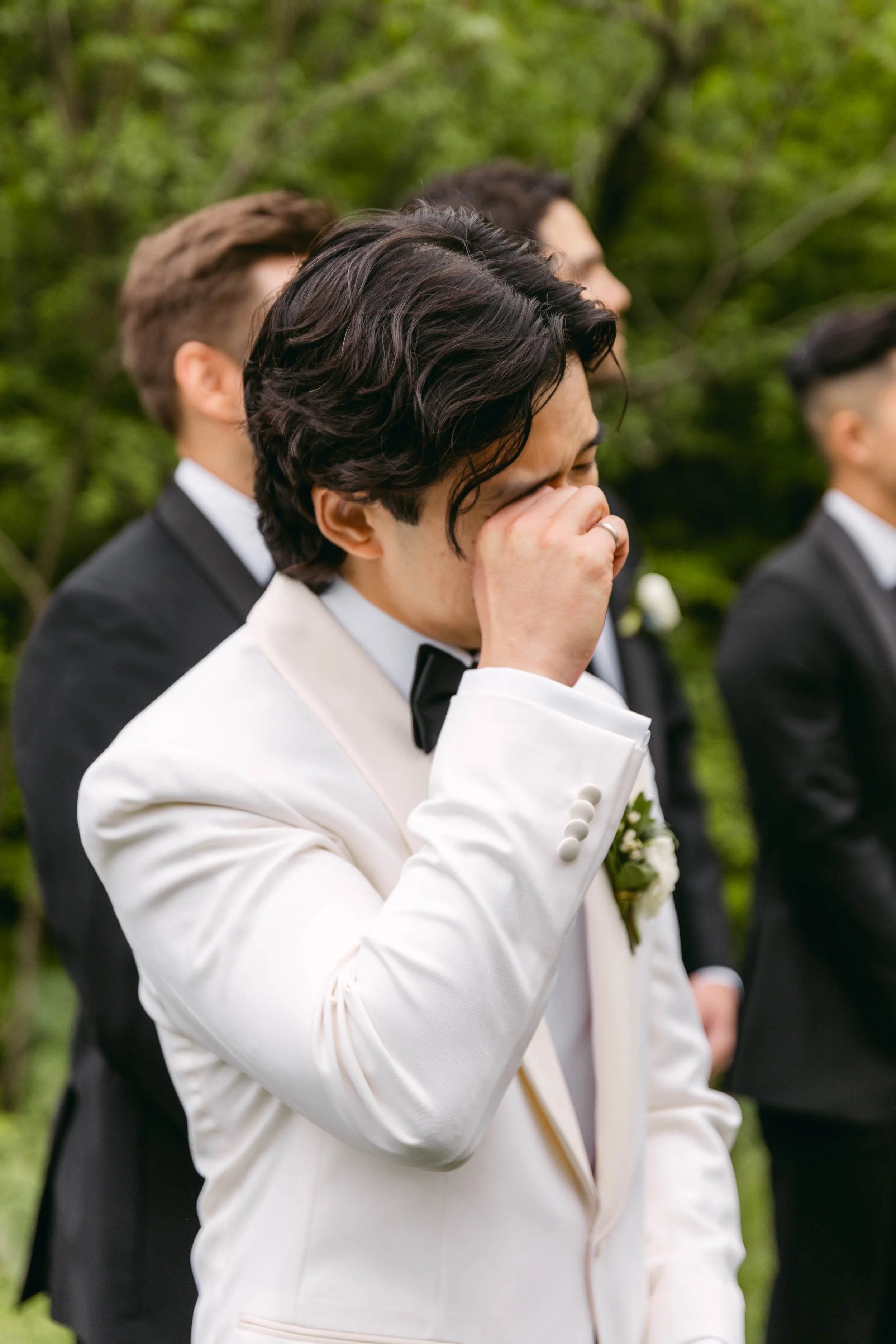Groom seeing bride during an emotional wedding ceremony entrance in Toronto.