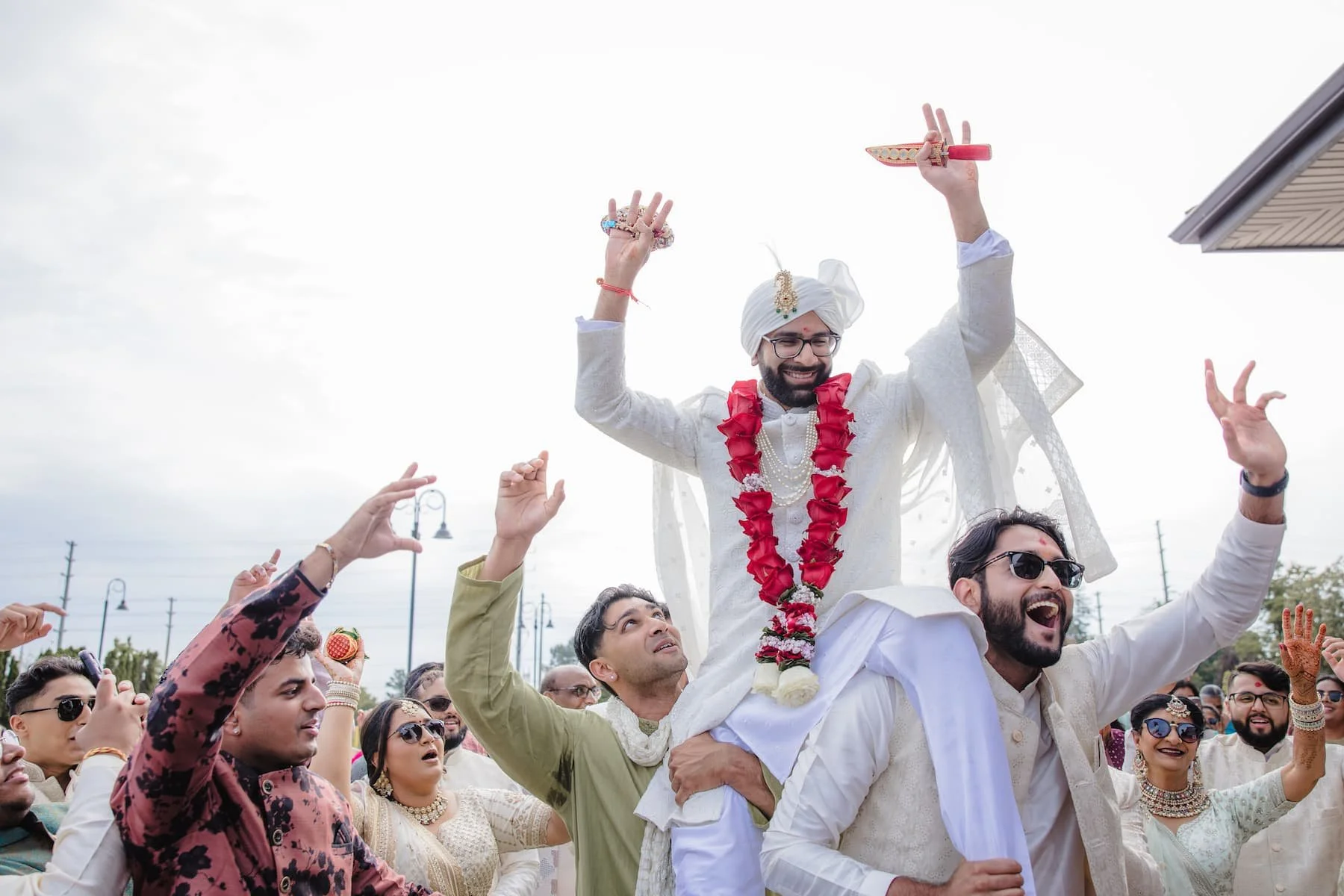 Groom celebrating during the baraat procession before Ashika and Sagar's Hindu wedding ceremony at Arlington Estate.