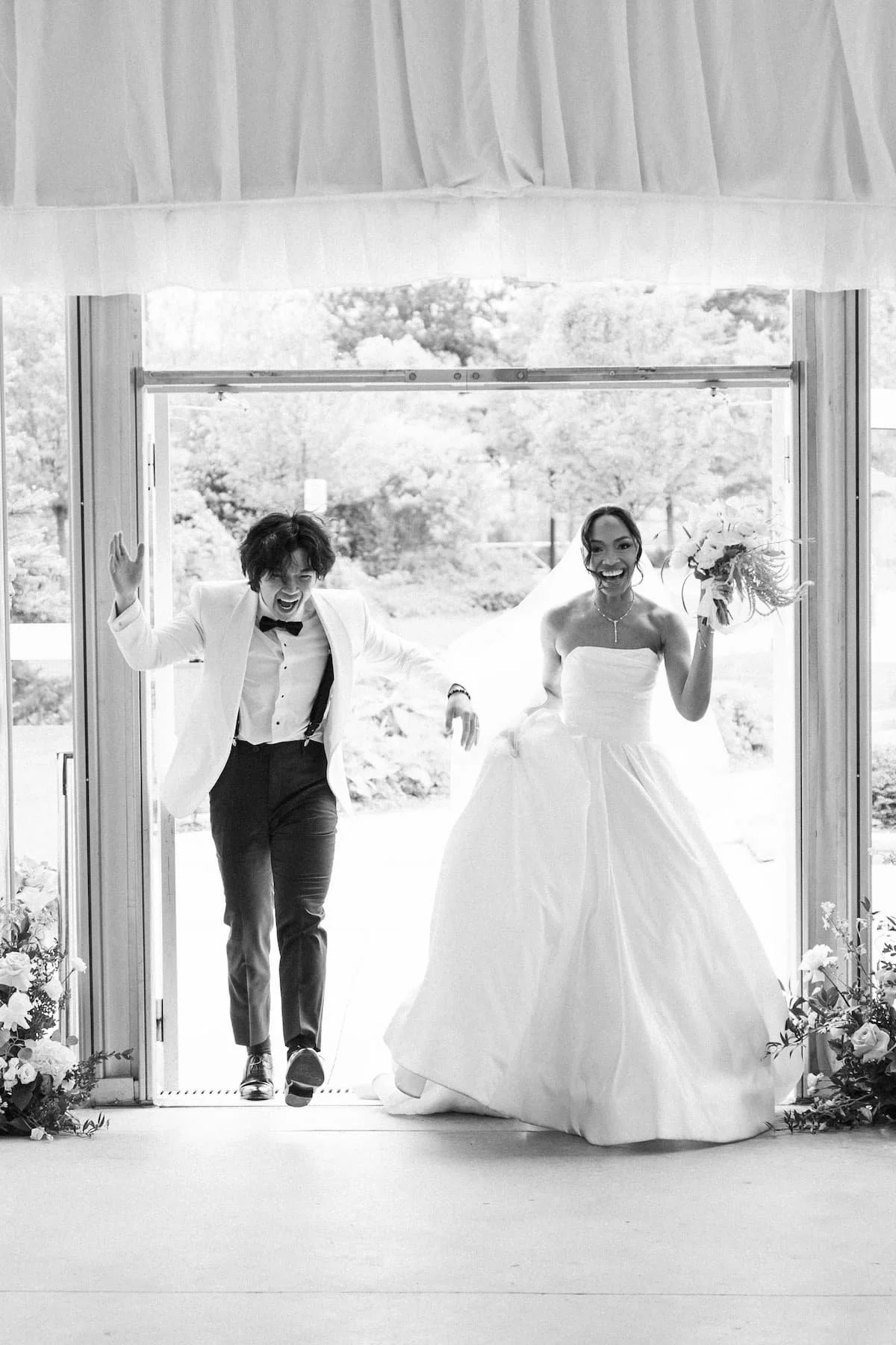 Bride and groom make their reception entrance together at Harding Waterfront Estate.