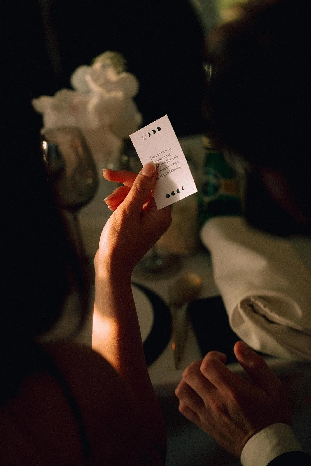 Guests enjoying conversation cards at a luxury fusion wedding at Lune 1860
