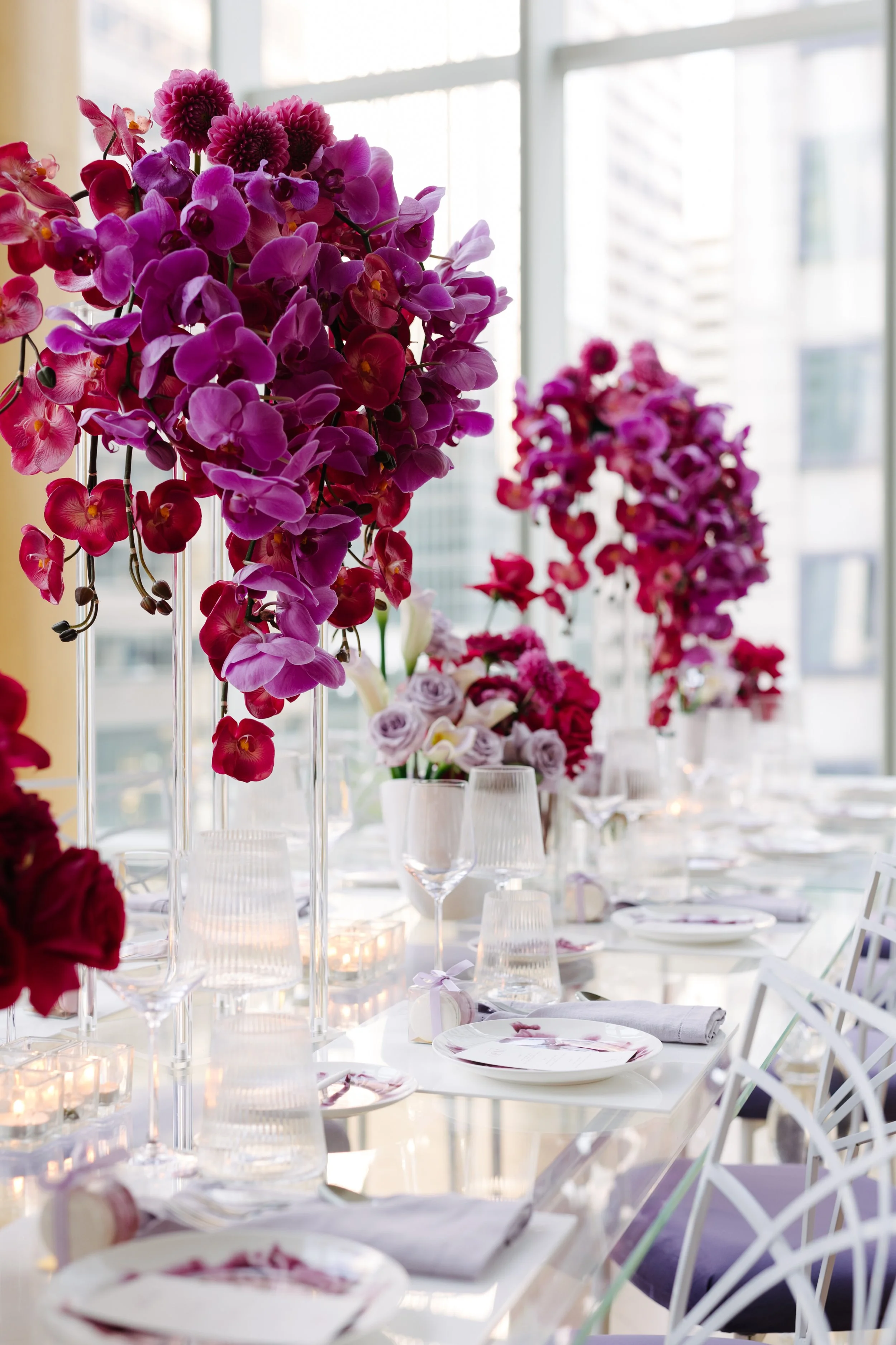 Elegant wedding reception at Shangri La Hotel Toronto with striking floral installations, thoughtfully planned and designed by Toronto wedding planners Events by Whim.