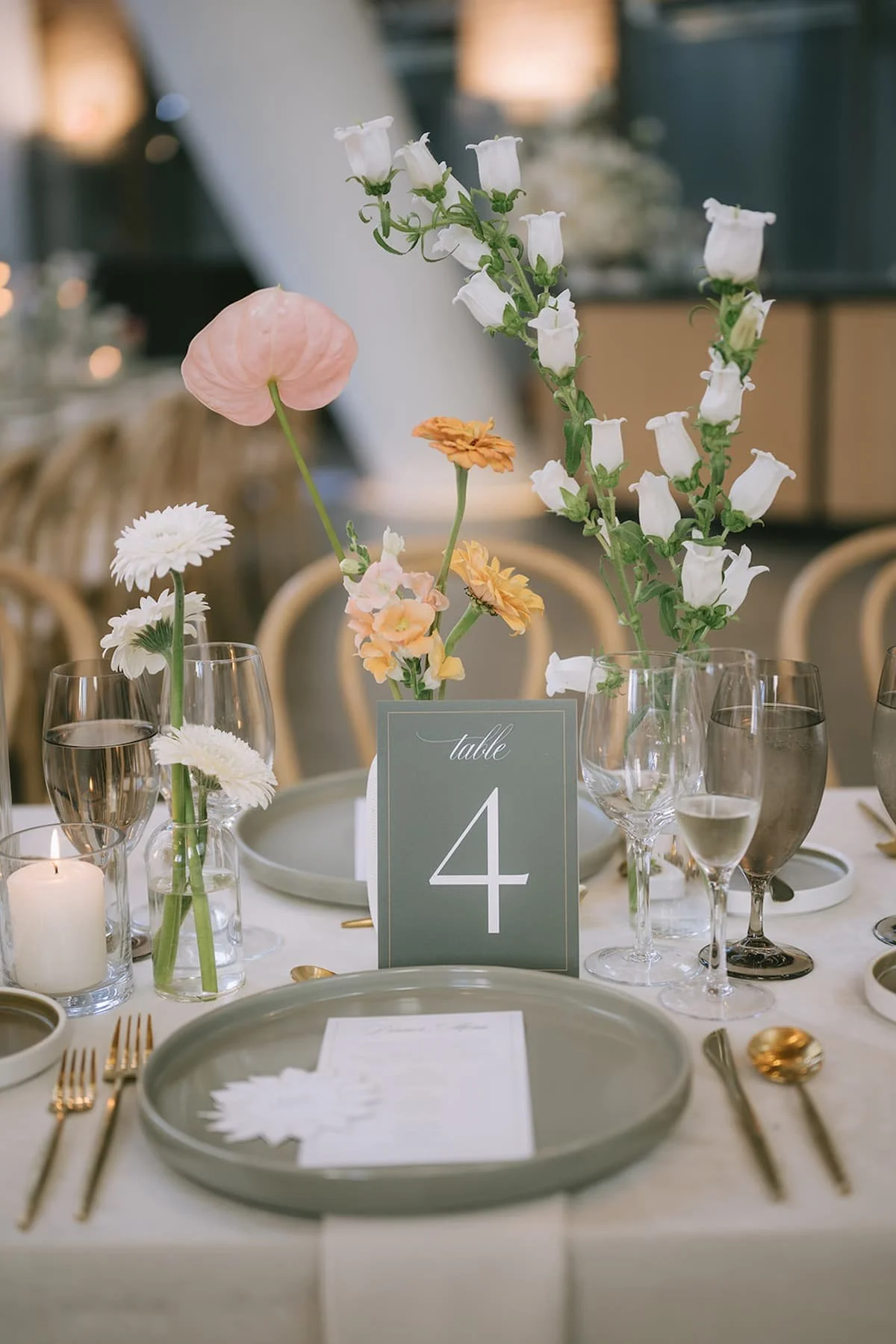 Custom wedding reception design at Ricarda's Toronto with rented furnishings, tabletop details and modern floral styling.