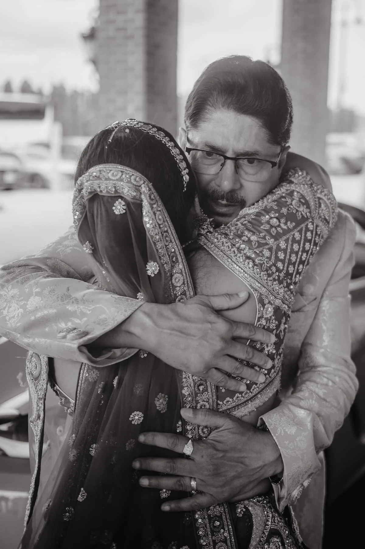 Ashika embraces her father during the emotional vidai at the end of her wedding celebrations at Arlington Estate.