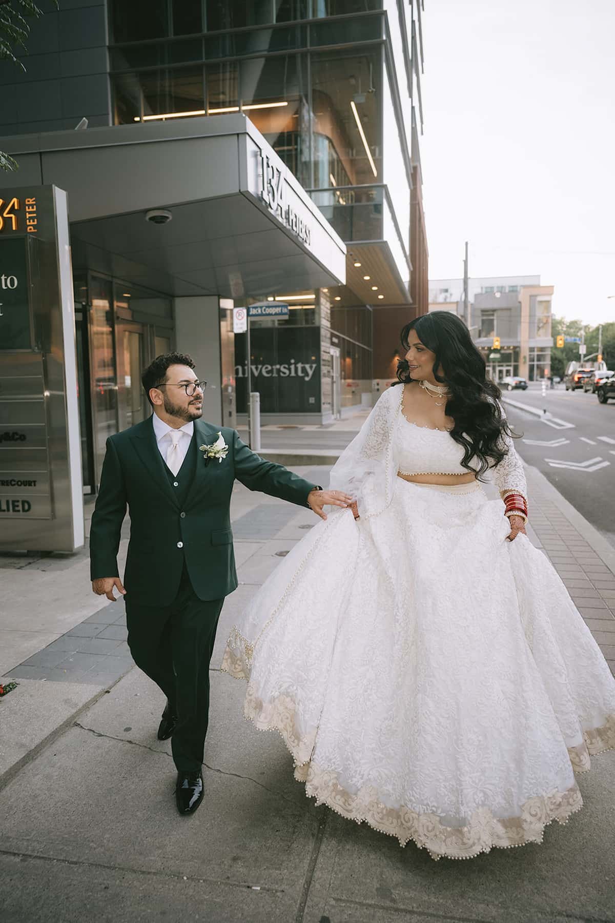 Fusion couple walking together before their wedding in Toronto, blending South Asian and Western wedding traditions with planning by Events by Whim.