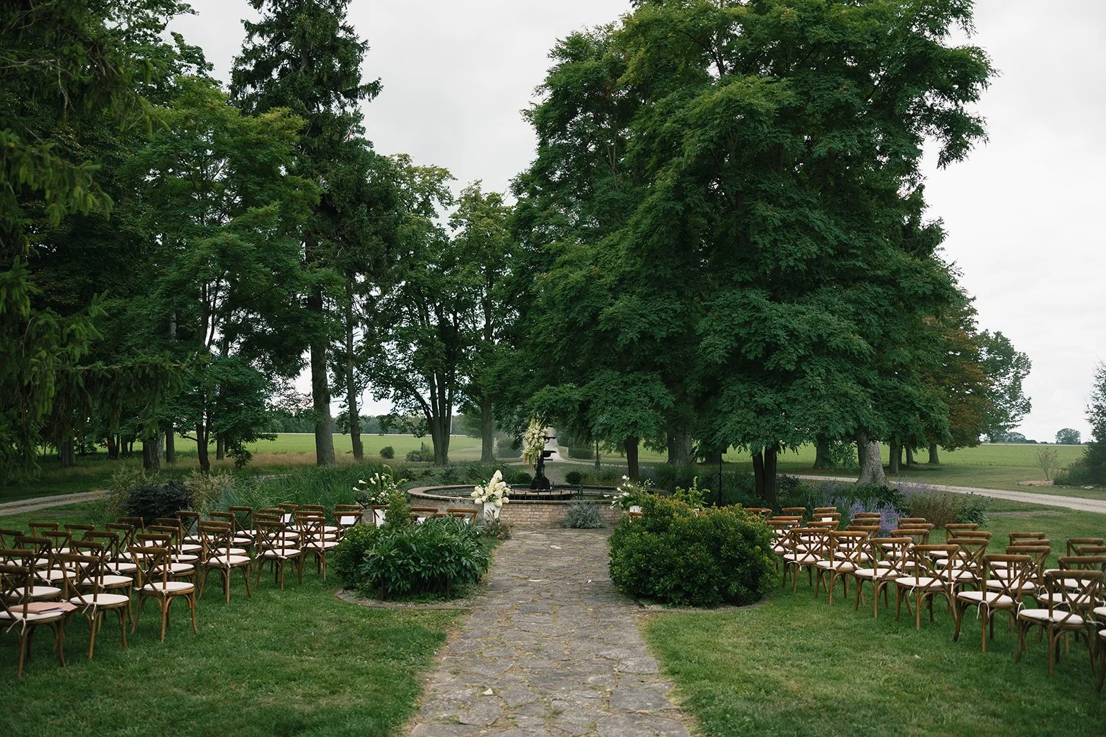 An outdoor wedding ceremony at the fountain in front of Lune 1860 in Goderich Ontario