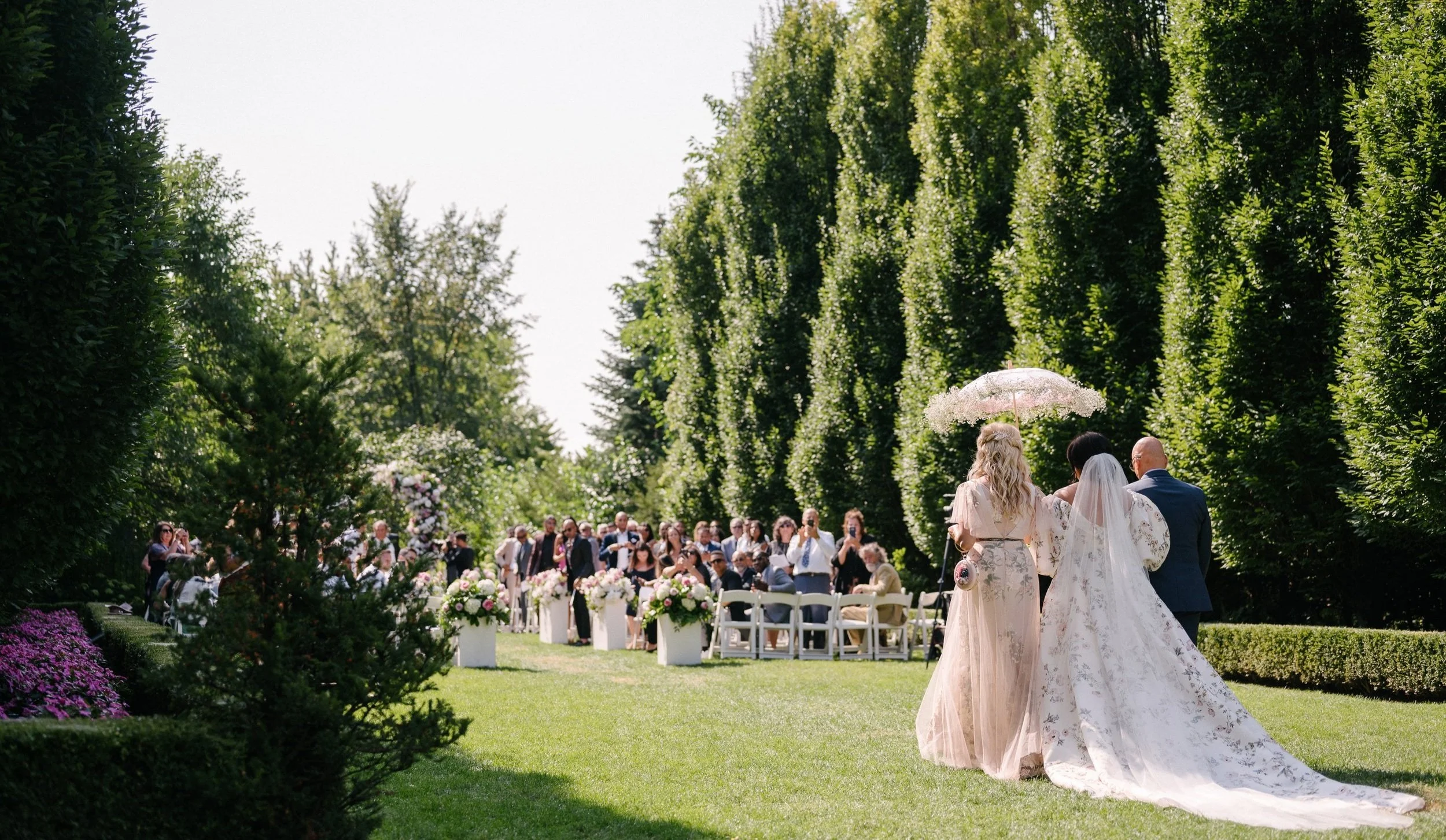 Luxury wedding ceremony at Graydon Hall Manor in Toronto featuring elegant floral design, refined architecture and timeless wedding styling.