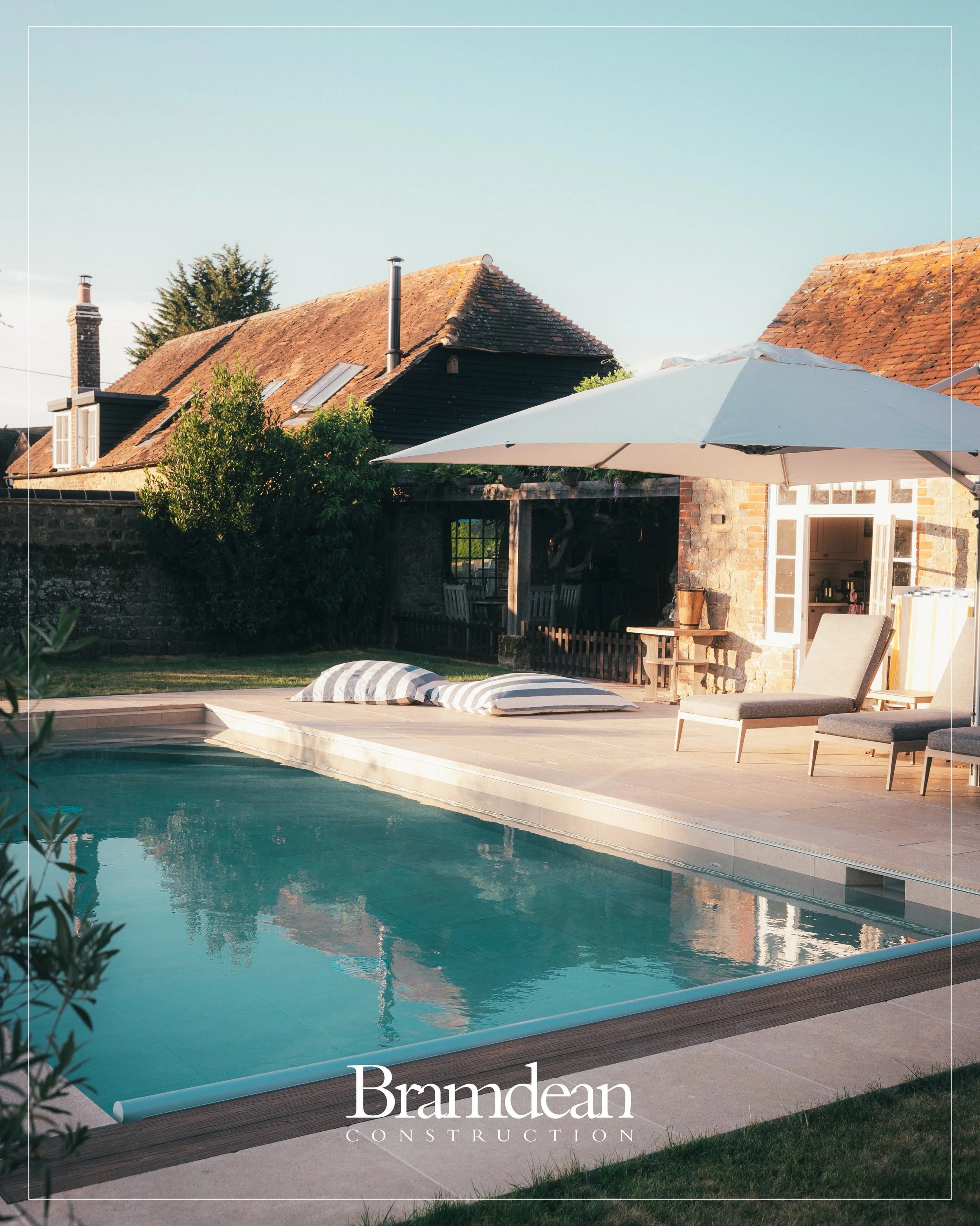 There comes a point in every project where the drawings, schedules and months of work quietly step into the background.

The doors are open. Dinner spills outside. The pool catches the last of the evening light. Children are still swimming while the 