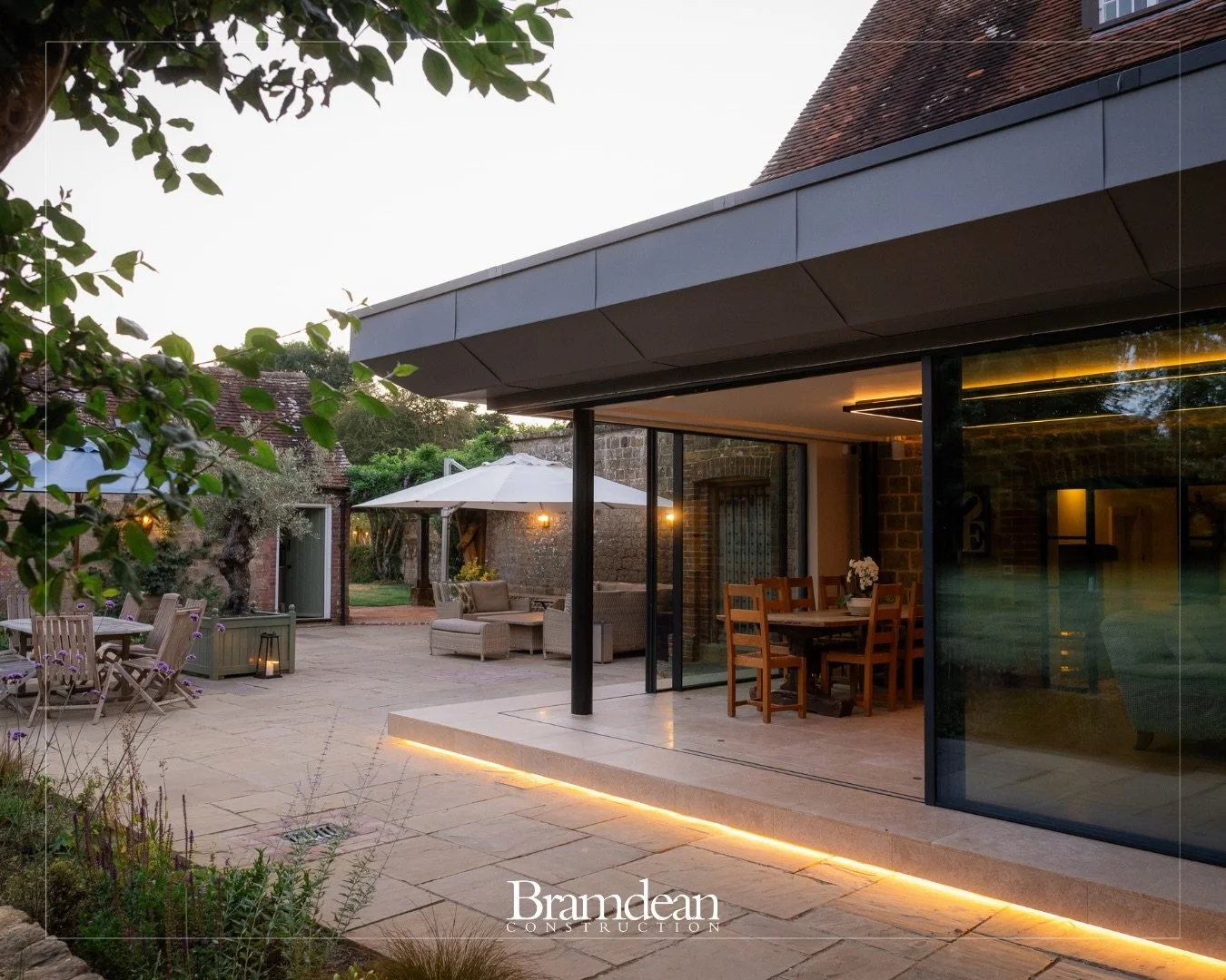 A complete transformation, while retaining the character of the original buildings.

This project saw an underused courtyard and existing outbuildings reworked to create a light-filled contemporary living space, with expansive glazing opening the int