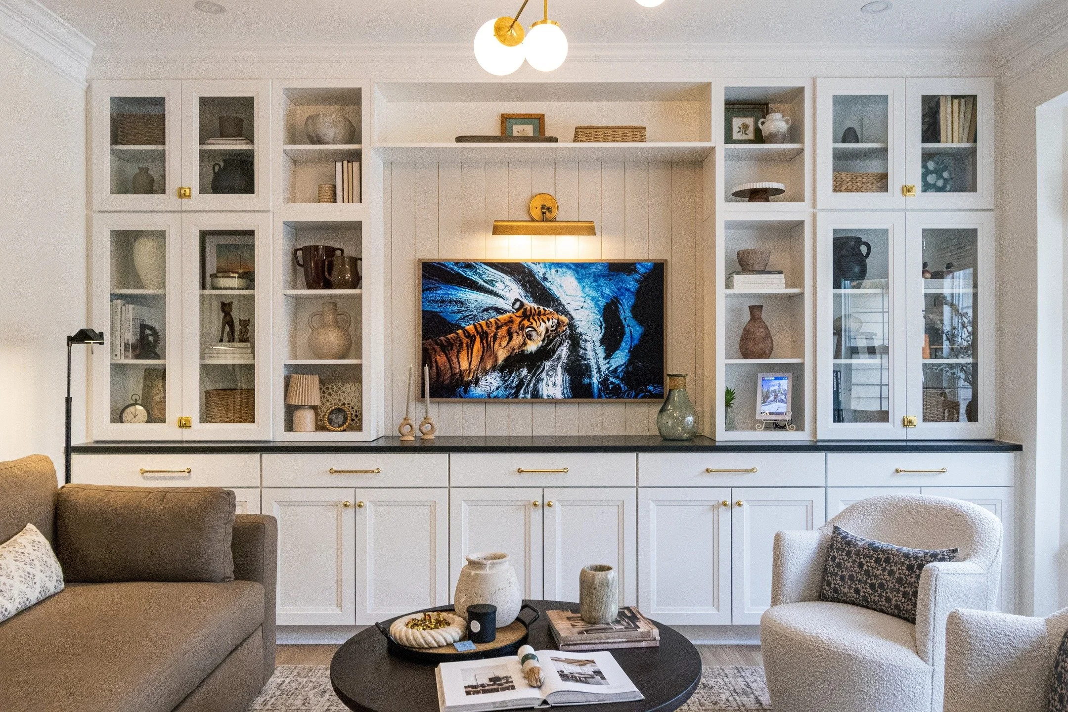 Happy first day of summer! 

With soaring temps in our town this week, there&rsquo;s no better escape than curling up indoors with a good book.

This former formal living room was reimagined as the ultimate lounge: opened-up walls, striking built-ins