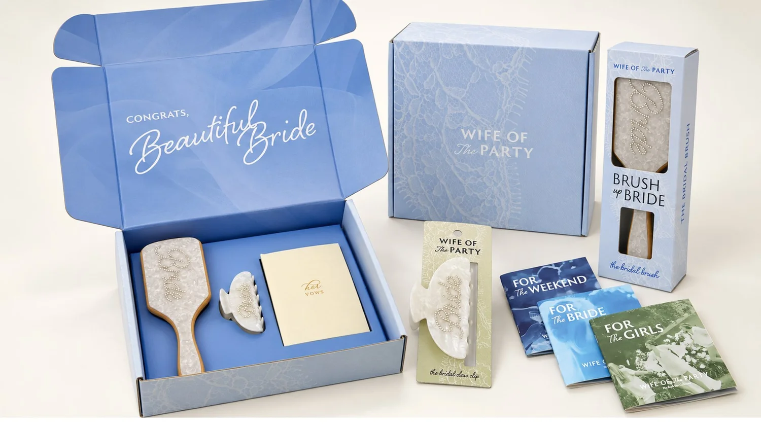 Wife of the Party bridal gift box open to show a hairbrush, claw clip, vow book and booklet