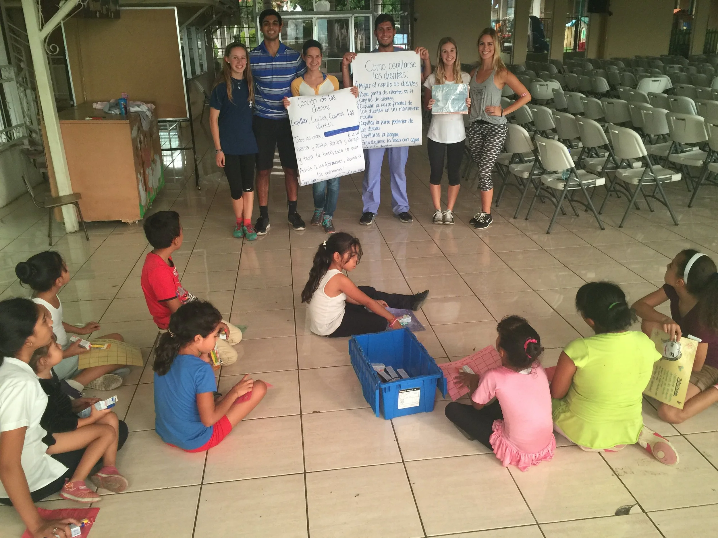 Danny Ashley teaching with student health volunteers