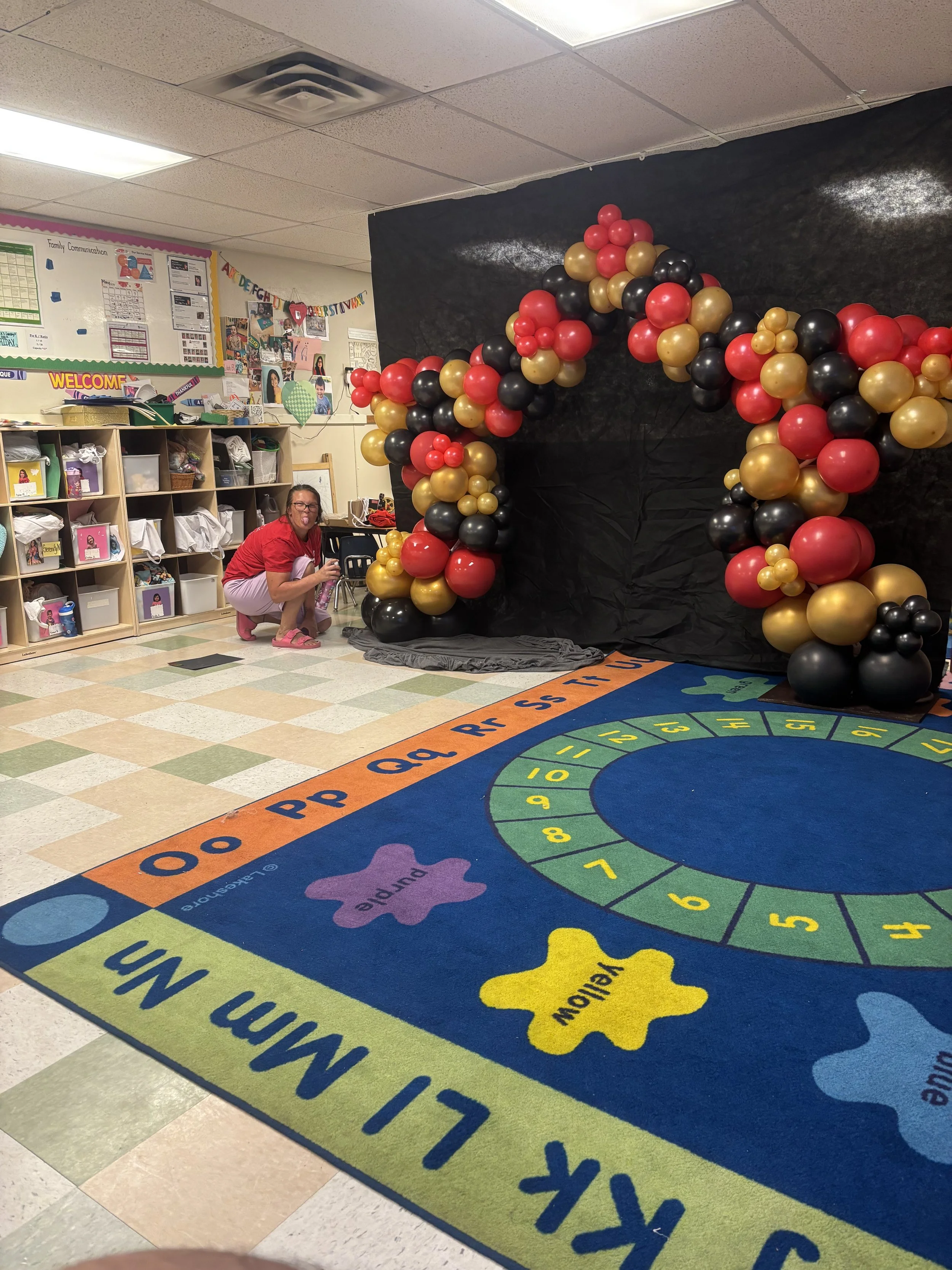 The Owner Brittany Carefully making sure the balloons were shining! (And being silly of course)