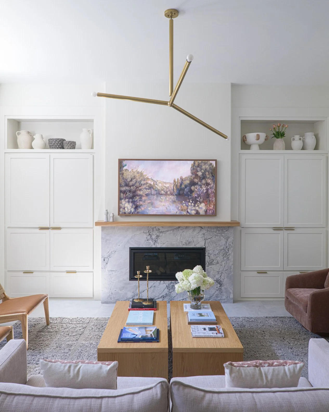 modern-living-room-with-centered-fireplace-built-in-bookcases.jpg
