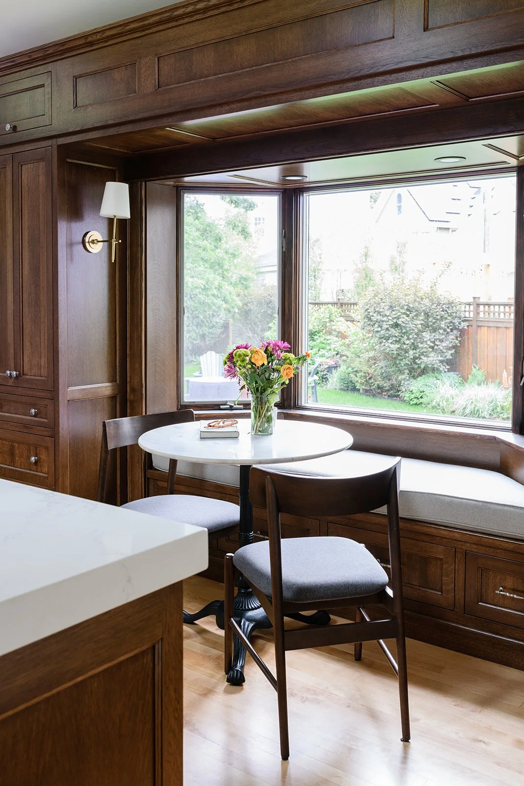 Breakfast nook designed to matched the home's original dark trim