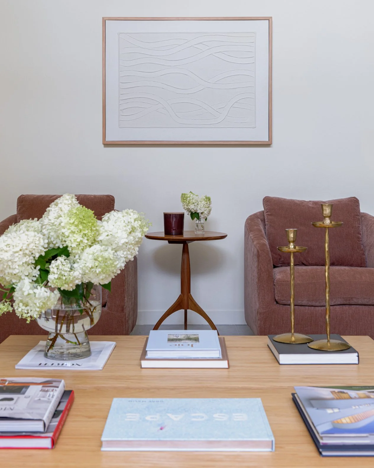 coffee-table-with-books-and-two-blush-chairs.jpg
