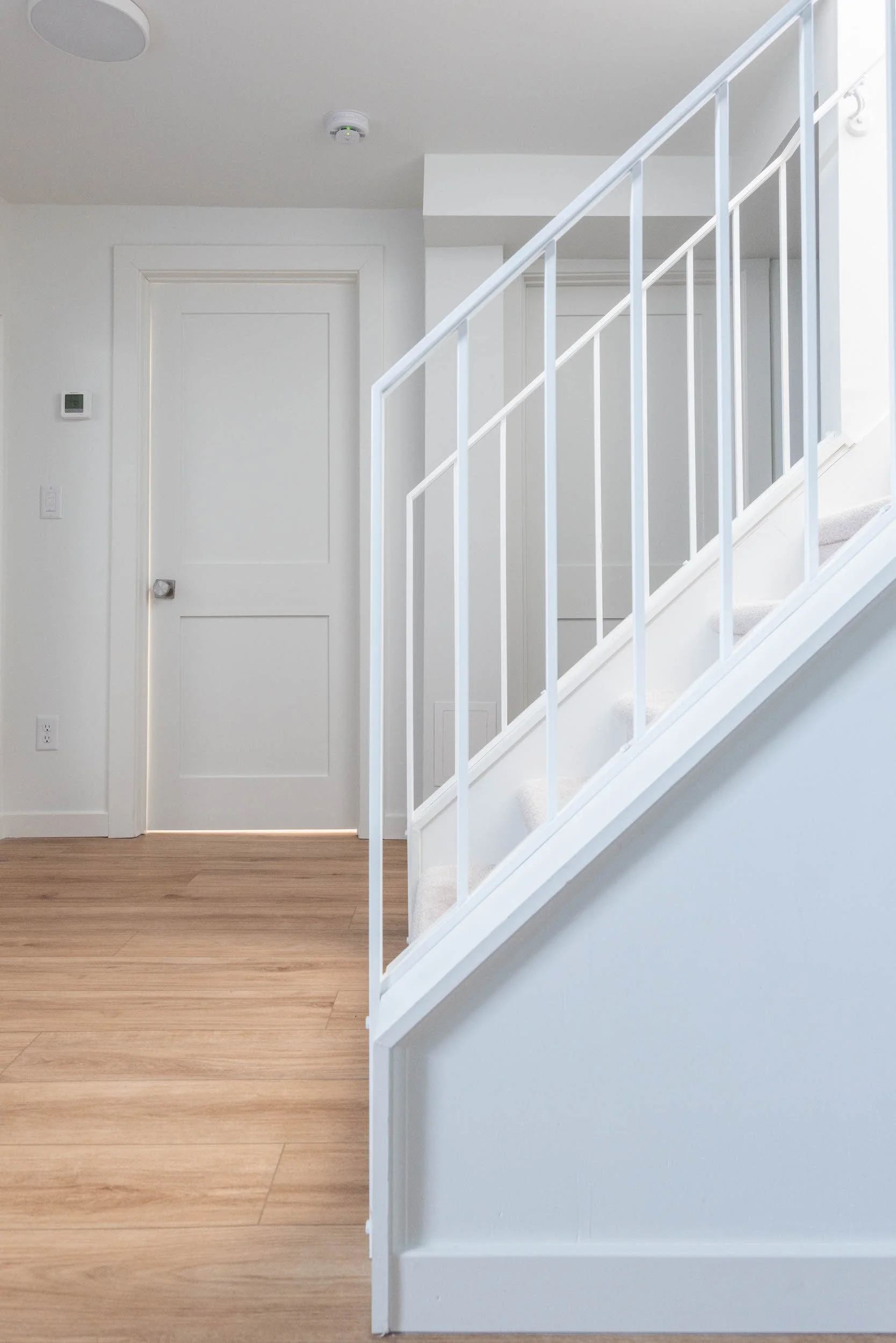 Modern white metal stair rail