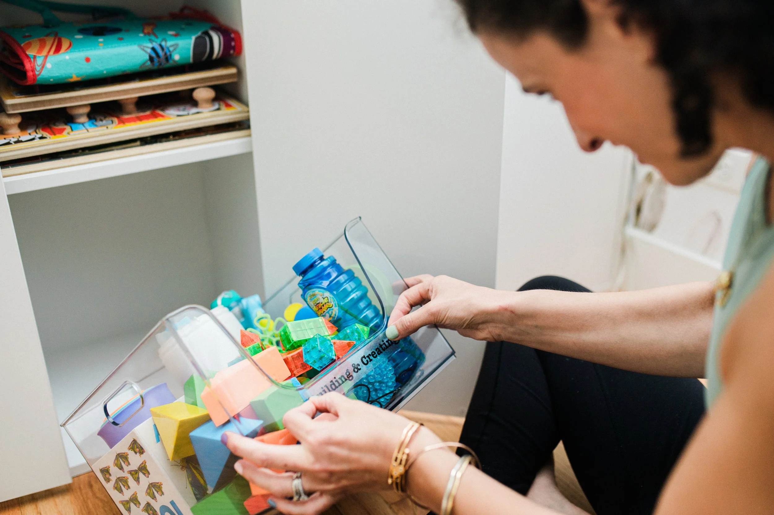 Happy Organized Denver sticking labels on clear container