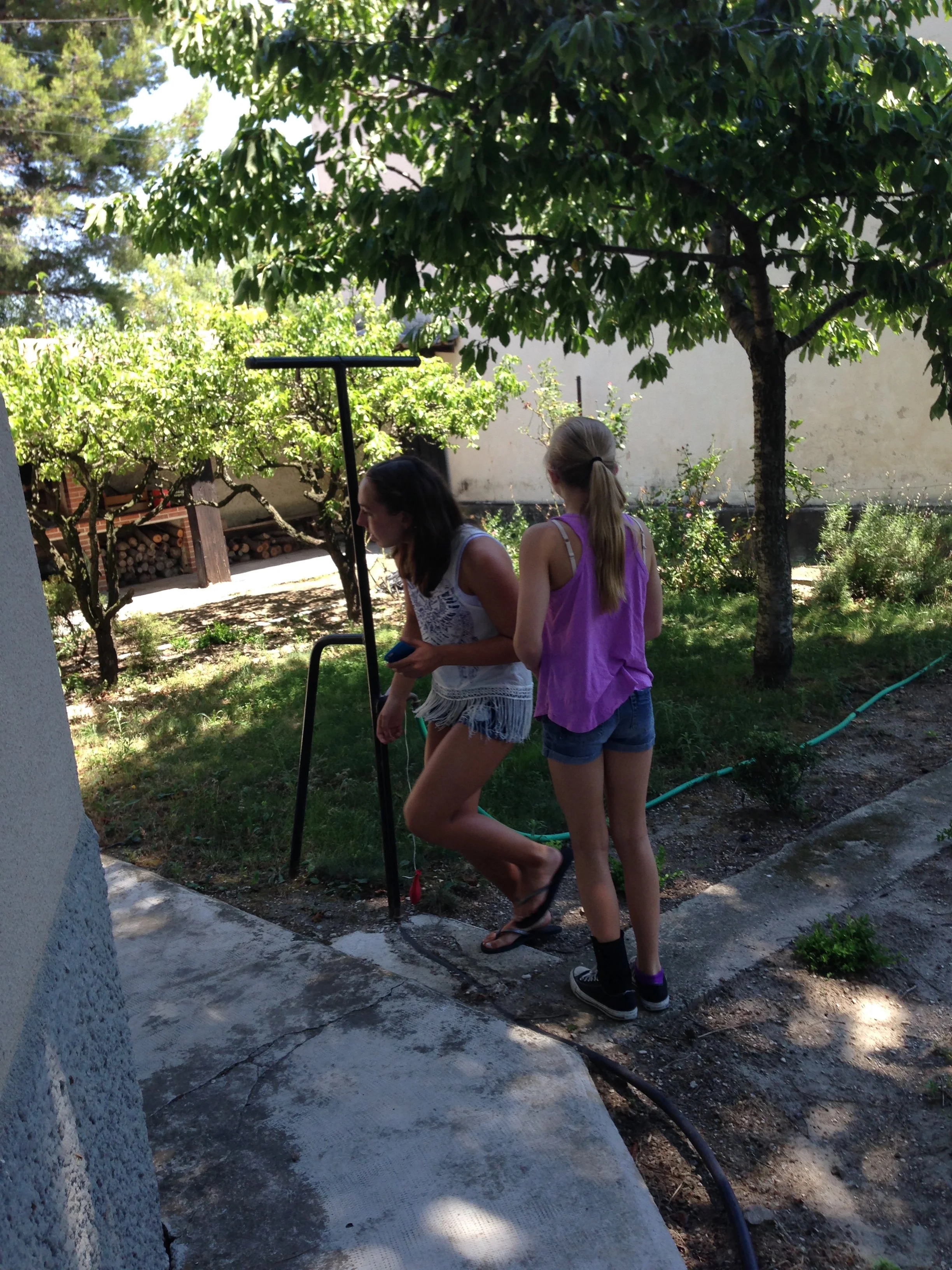 Rhonda's children playing in the courtyard of her aunt's home in Orange, France