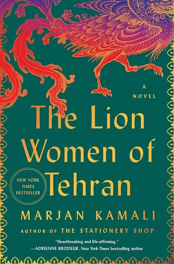 Book cover for "The Lion Women of Tehran" by Marjan Kamali. Features a stylized orange and gold lion with intricate feather details on a dark green background, with decorative gold borders.