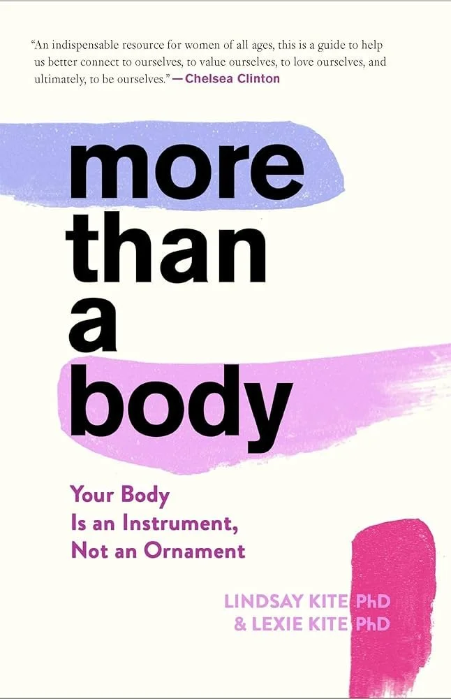 Book cover with the title "more than a body" in large black and purple text, a quote from Chelsea Clinton at the top, and the authors Lindsay Kite PhD and Lexie Kite PhD at the bottom, with colorful brushstroke designs in purple and pink.