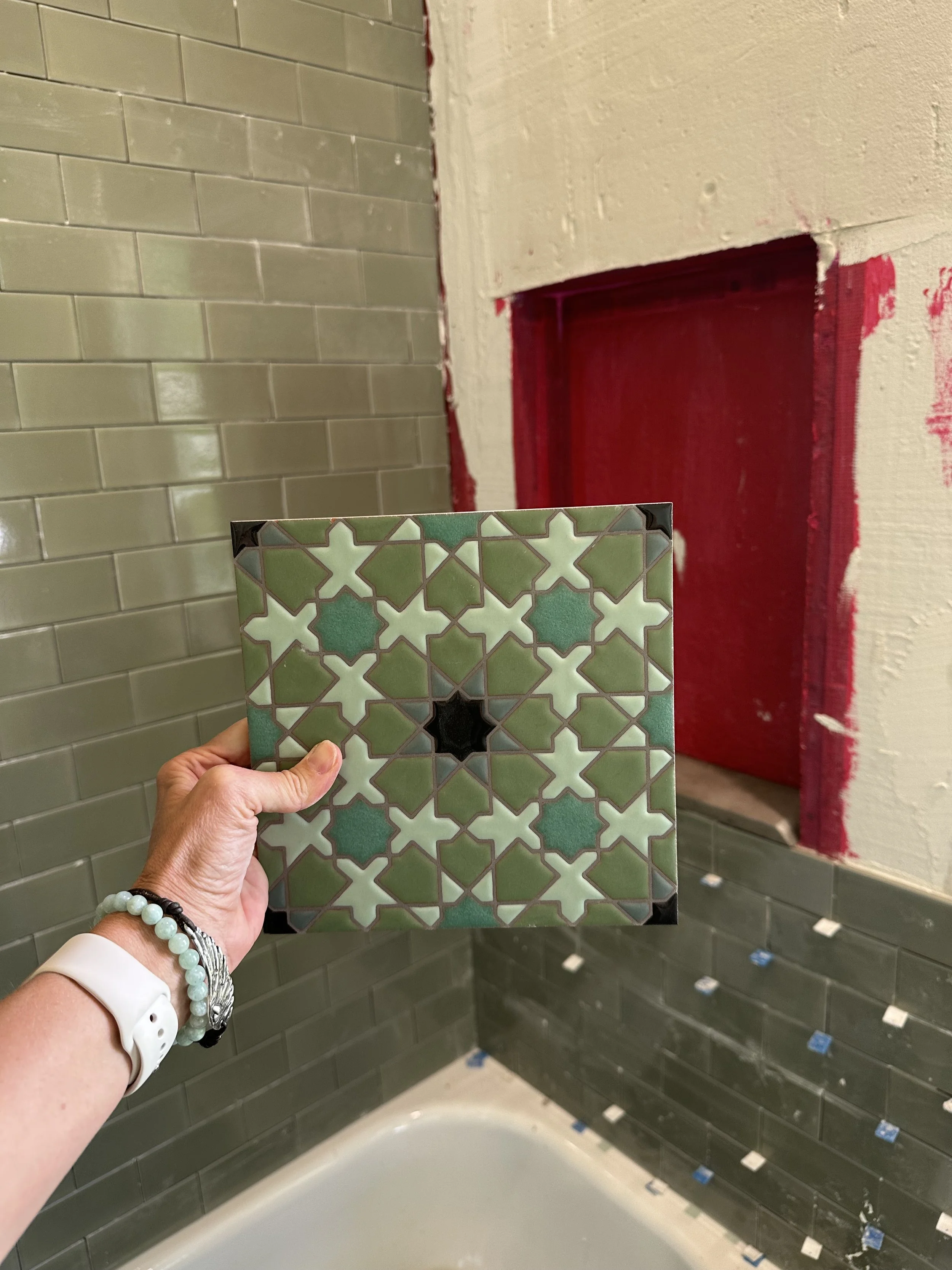 Designer collaborating with contractor to align on scope and finish details during remodel