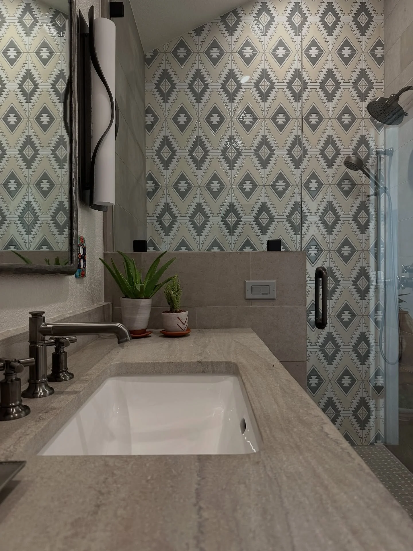 What&rsquo;s your favorite detail?

This bath came together through quiet layers &mdash; soft stone, graphic pattern, warm neutrals, and a little contrast in the plumbing and shower hardware to ground it all.

I love how the shower tile brings moveme