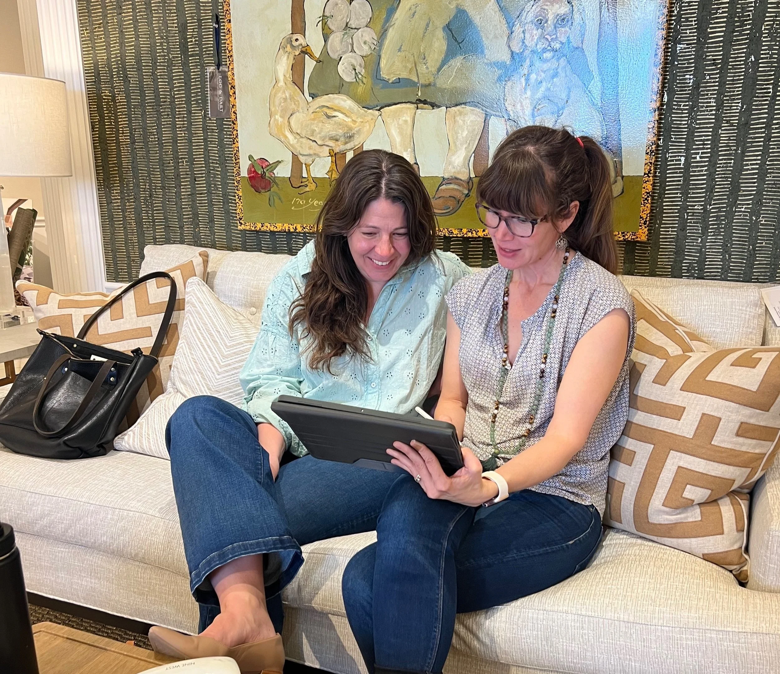 Sara reviewing kitchen materials with a client during a guided design tour.