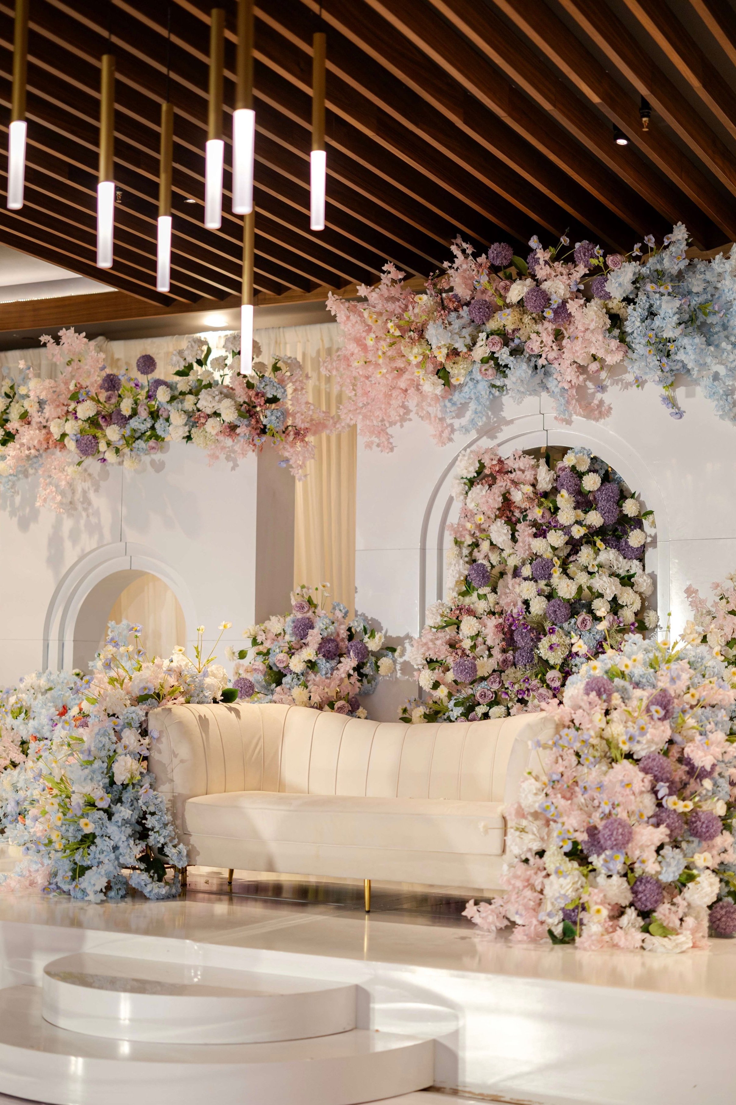 Indian Wedding Decorator White Arches with light floral in purple, blue, blush pink, peach and white Dancefloor Wrap Massachusetts, Boston, Rhode Island, New Hampshire