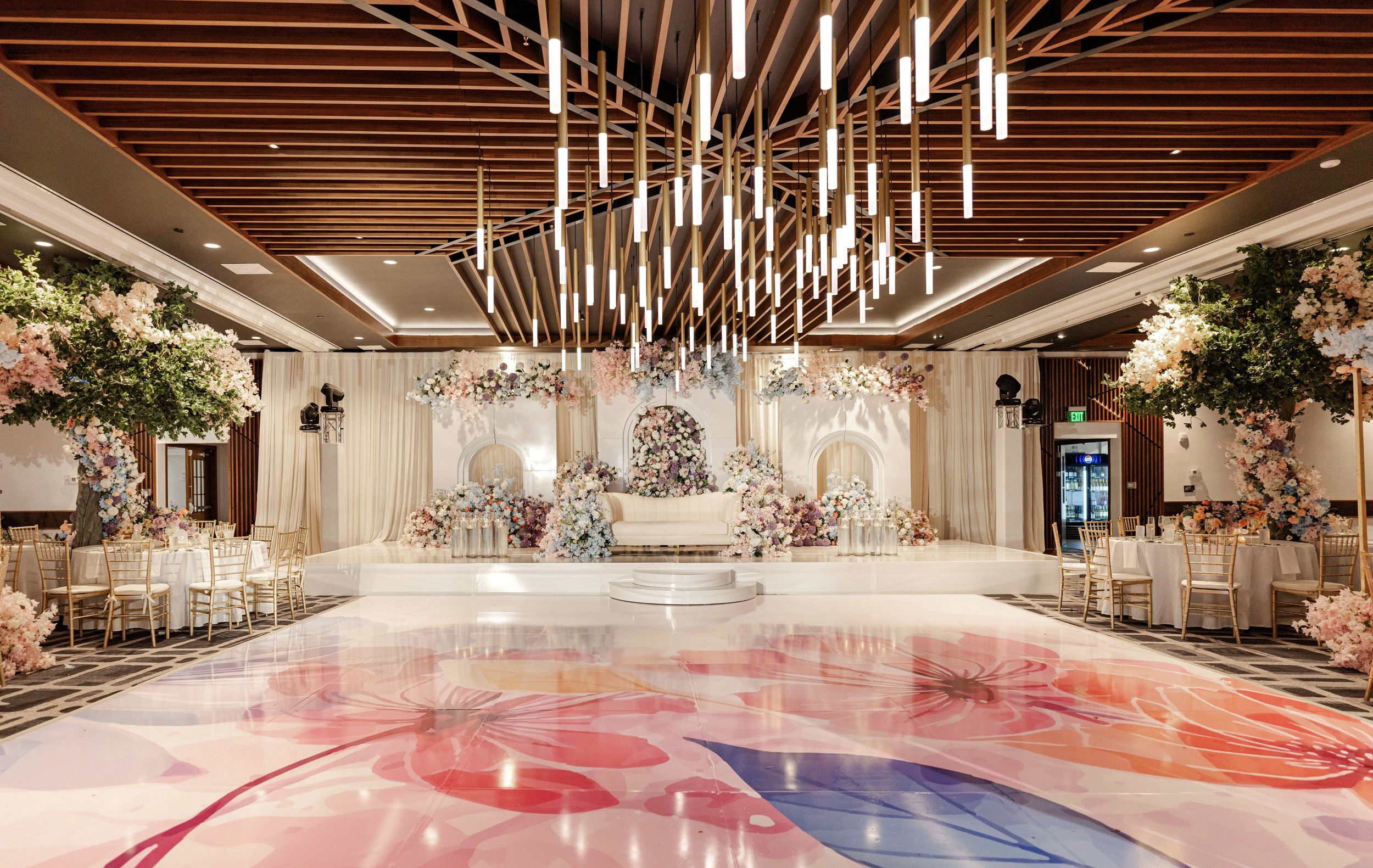 Indian Wedding Decorator White Arches with light floral in purple, blue, blush pink, peach and white Dancefloor Wrap Massachusetts, Boston, Rhode Island, New Hampshire