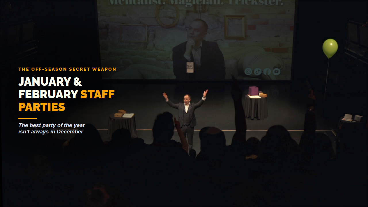 Mentalist Jeff Newman raises his arms in celebration on a theatre stage, beside the title January and February Staff Parties.